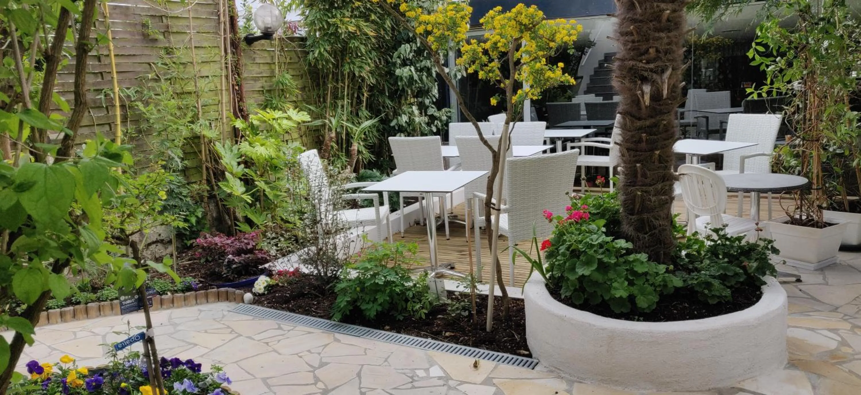 Patio in Logis Hôtel Les Bleuets