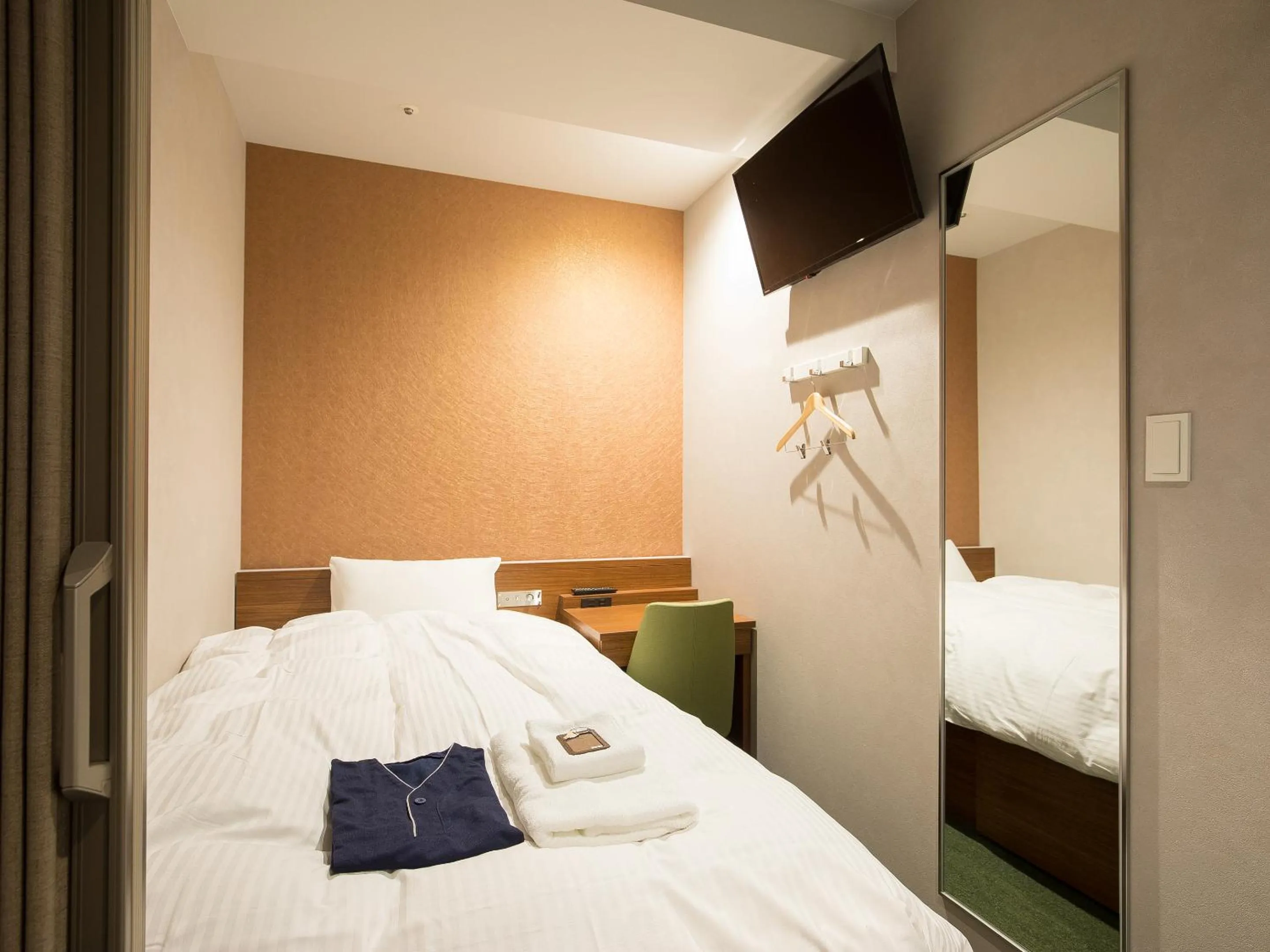 Bed in Gardens Cabin