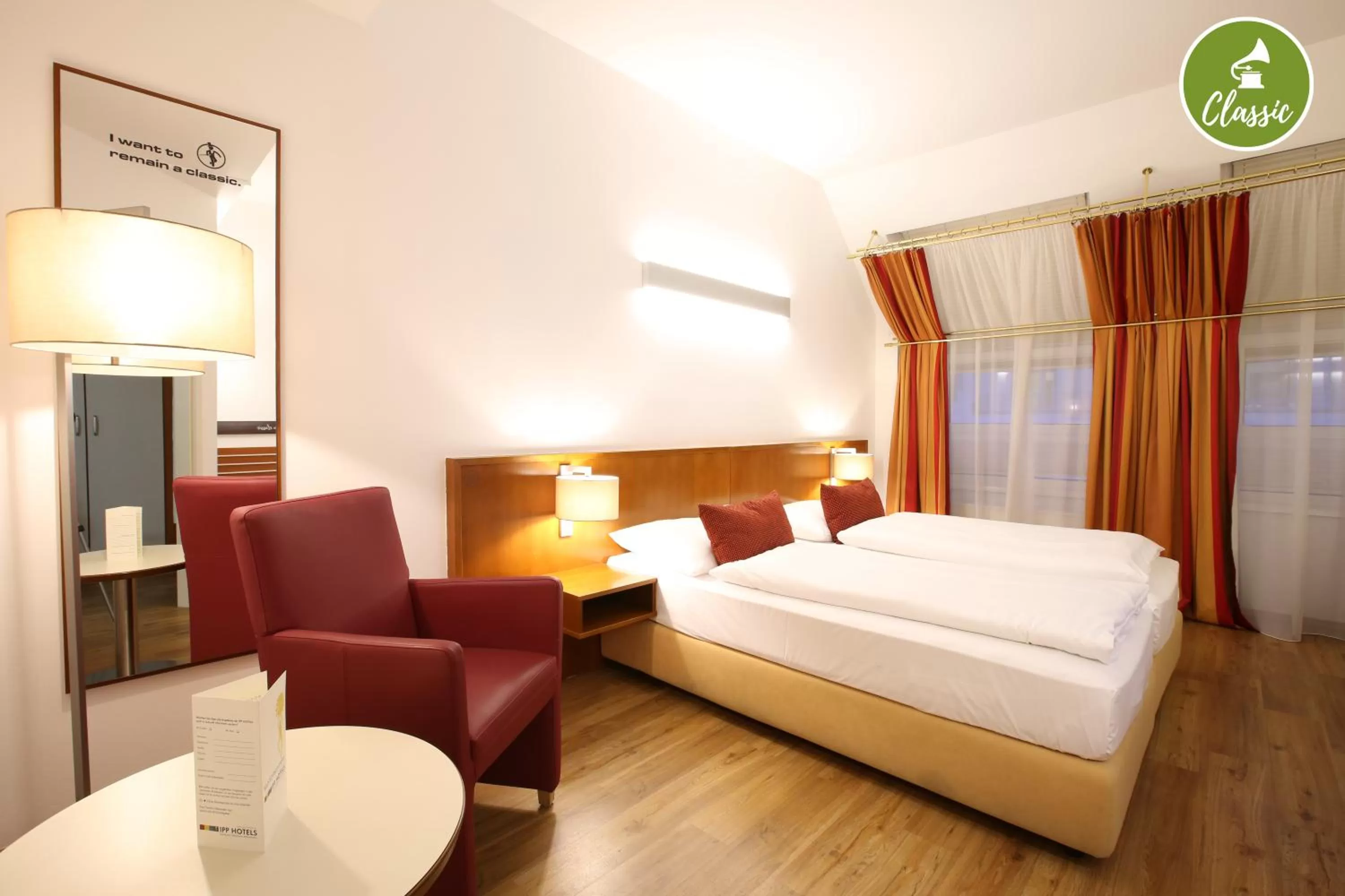 Seating area, Bed in arte Hotel Wien Stadthalle