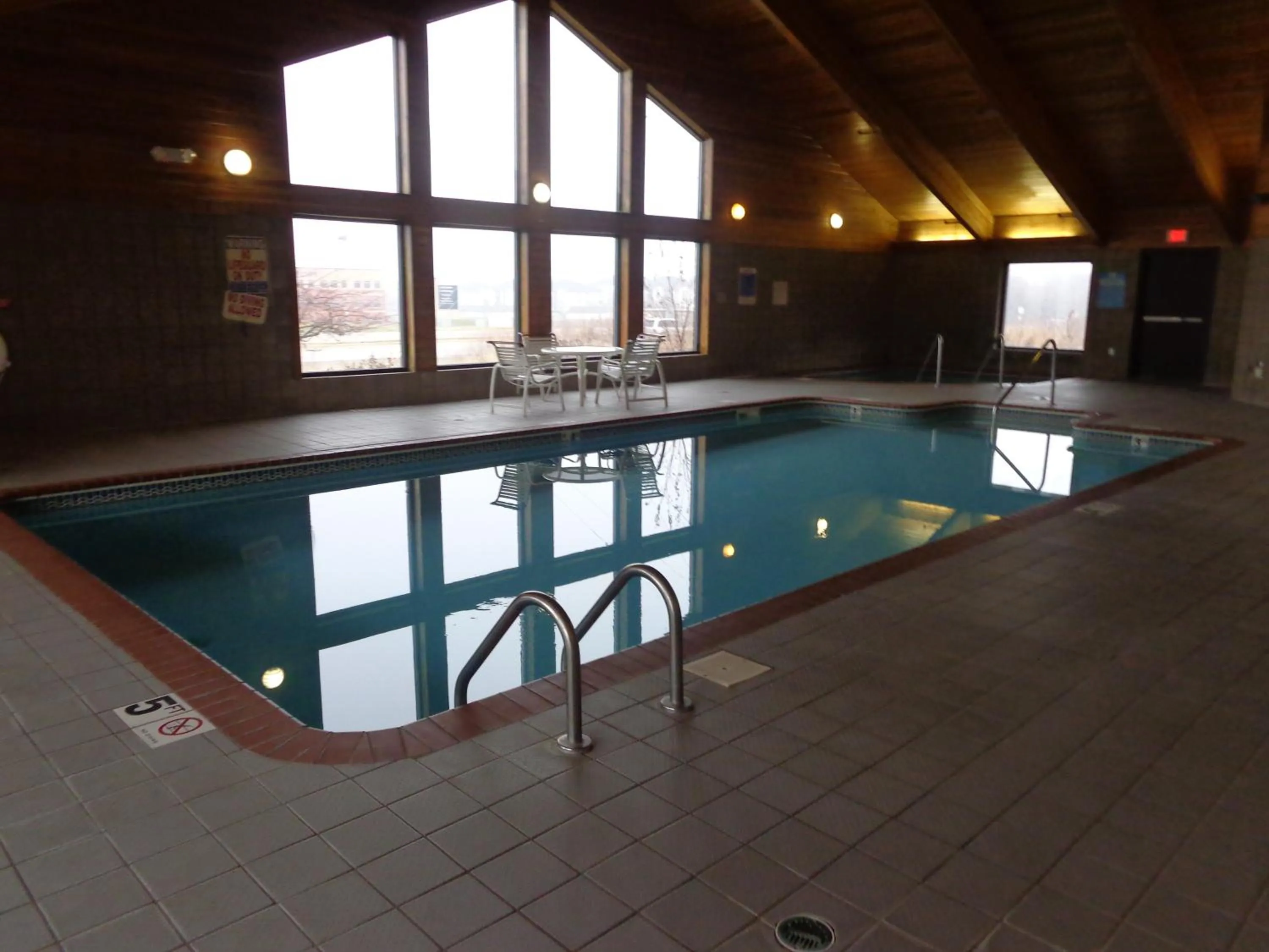 Swimming pool in AmericInn by Wyndham Coralville