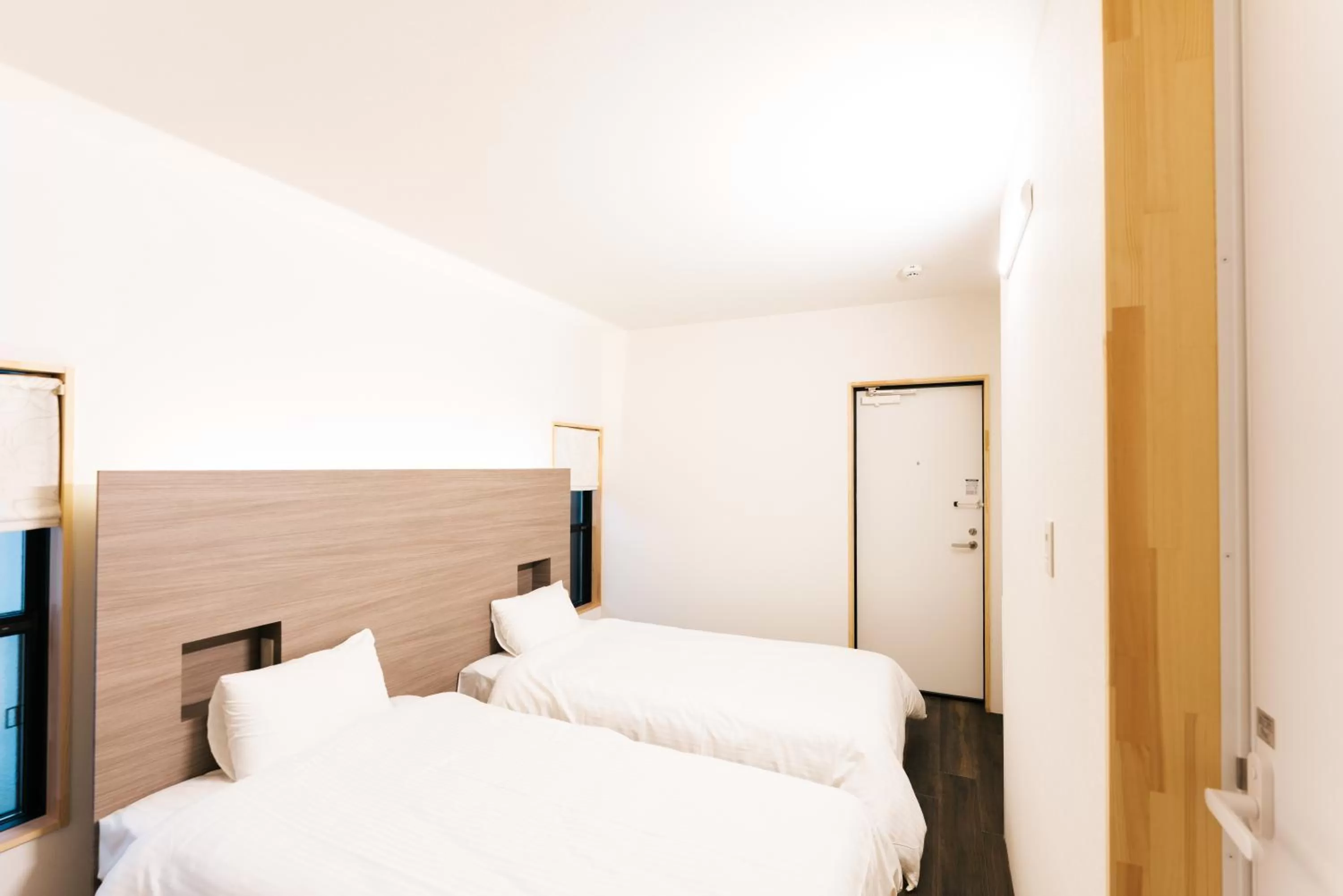 Bed in B&B MIKAWA Info Centre - Kanazawa Fish Harbour