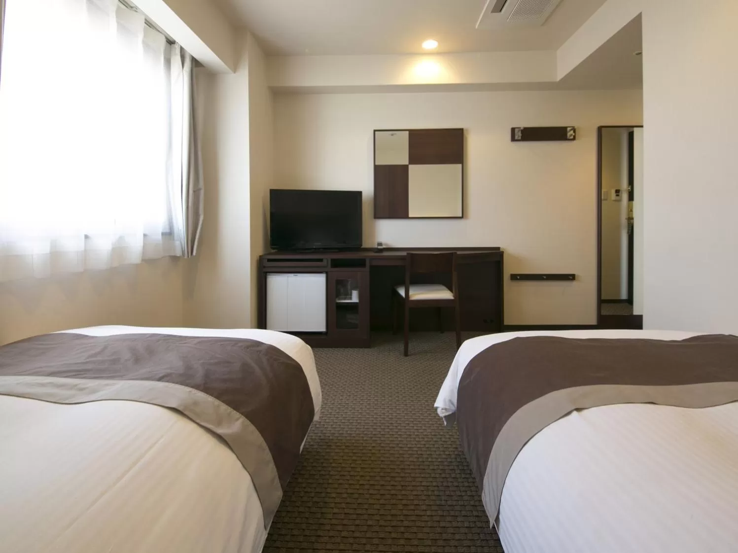 Bed in Urban Hotel Minami Kusatsu