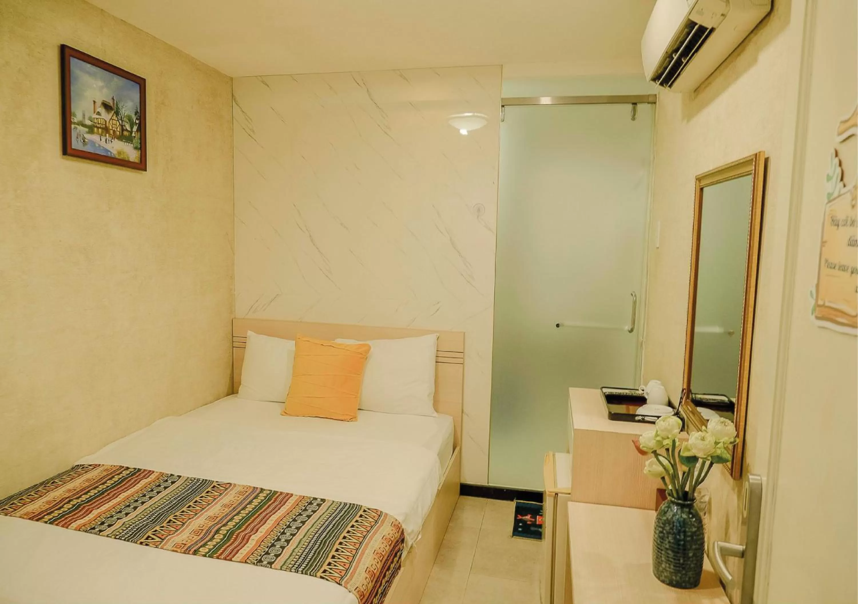 Bed in Galaxy Boutique Sai Gon Central Hotel