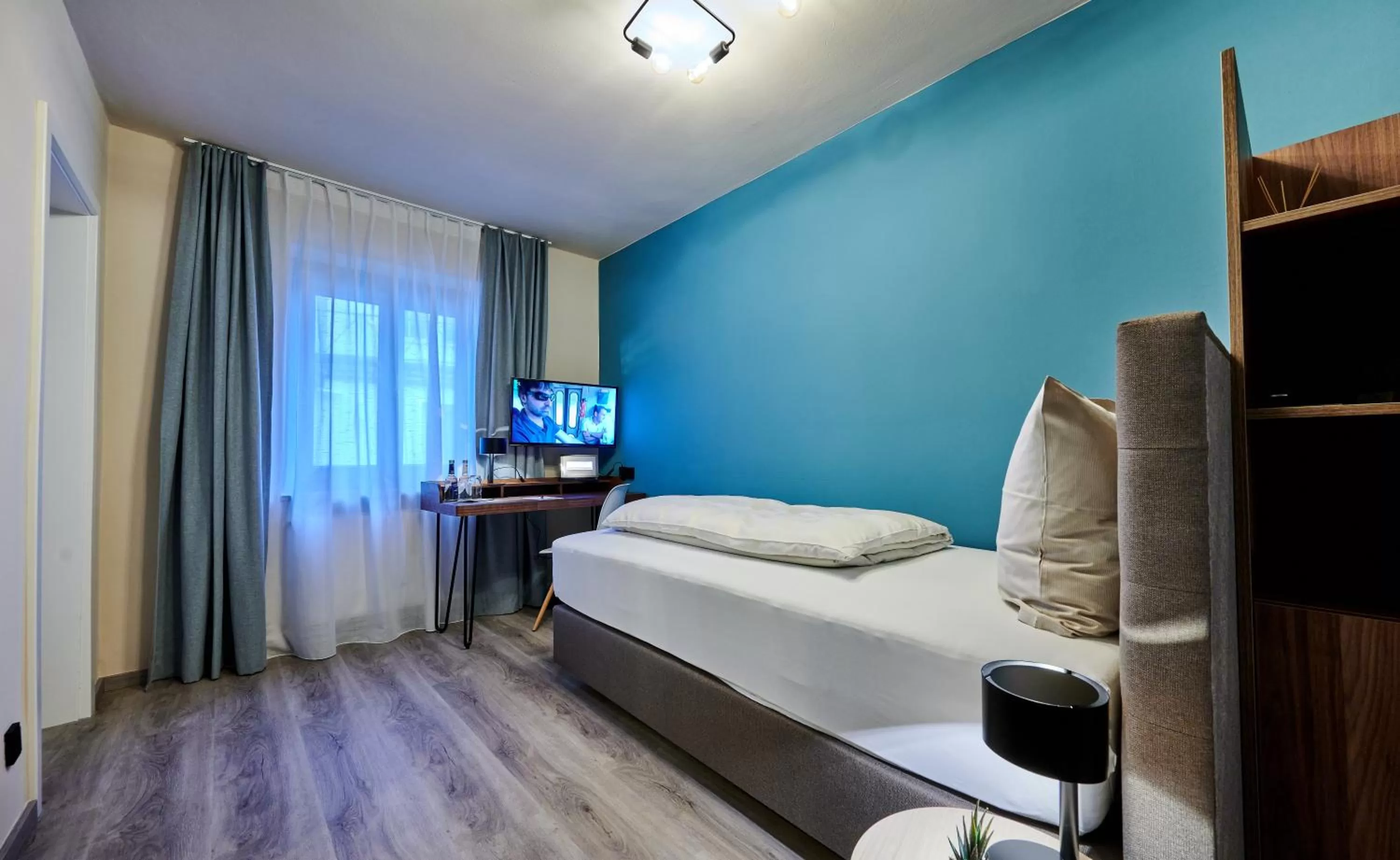 Photo of the whole room, Bed in Genusshotel Wenisch