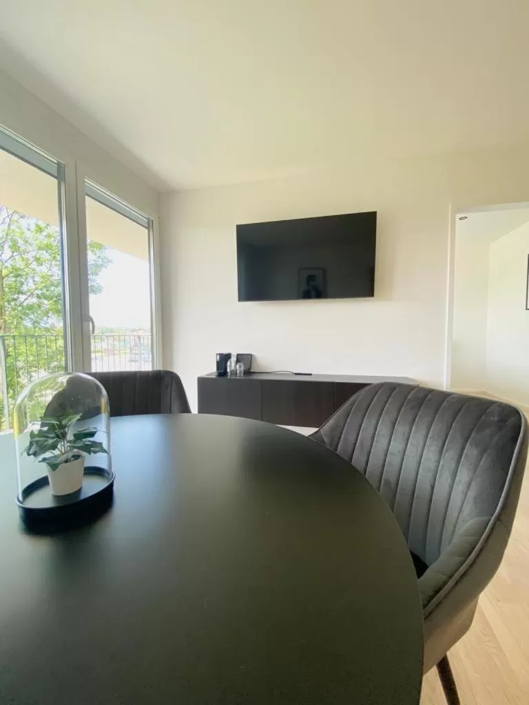 Living room, TV/Entertainment Center in Village by Maier - kontaktloser Check-in