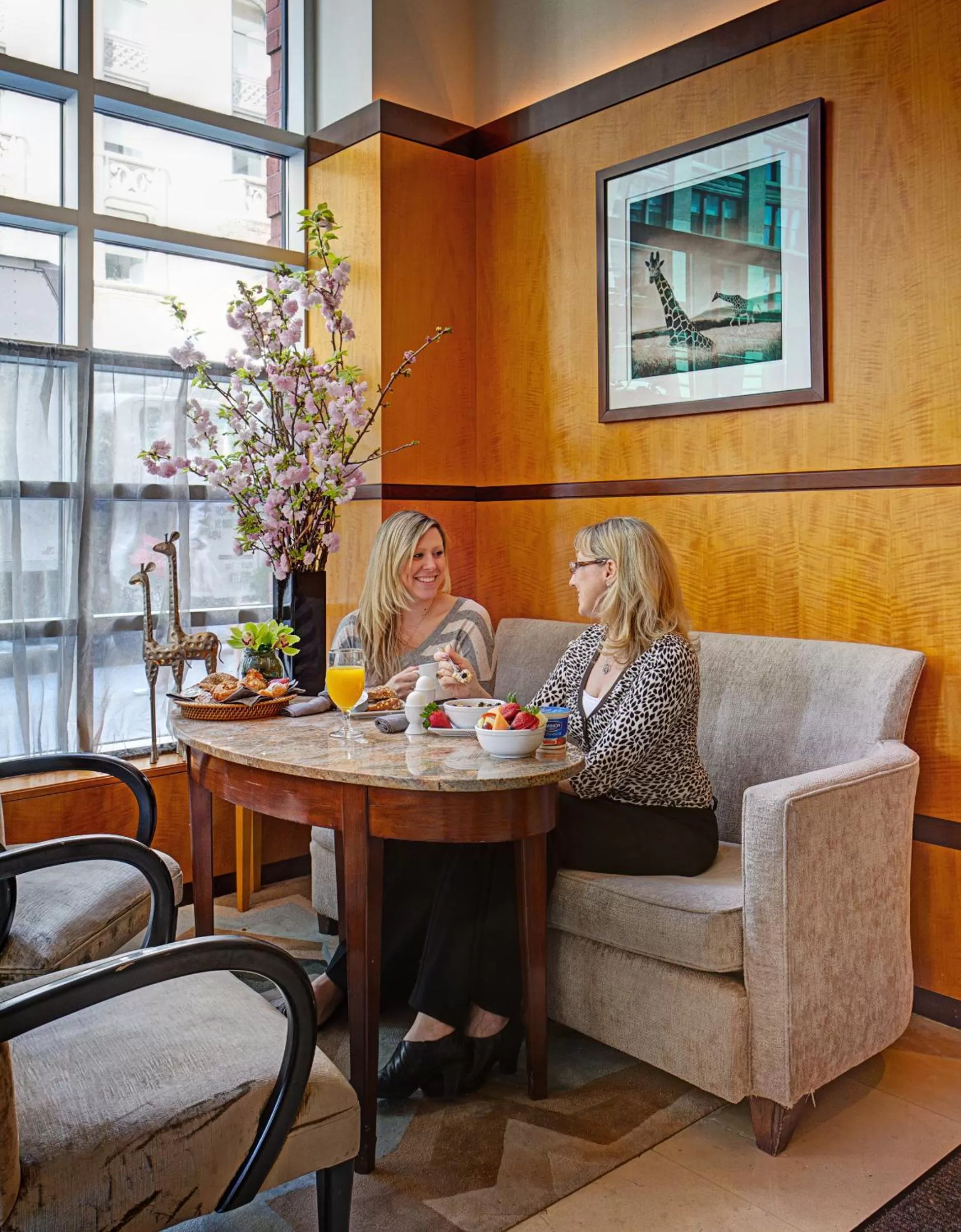 People in Hotel Giraffe by Library Hotel Collection