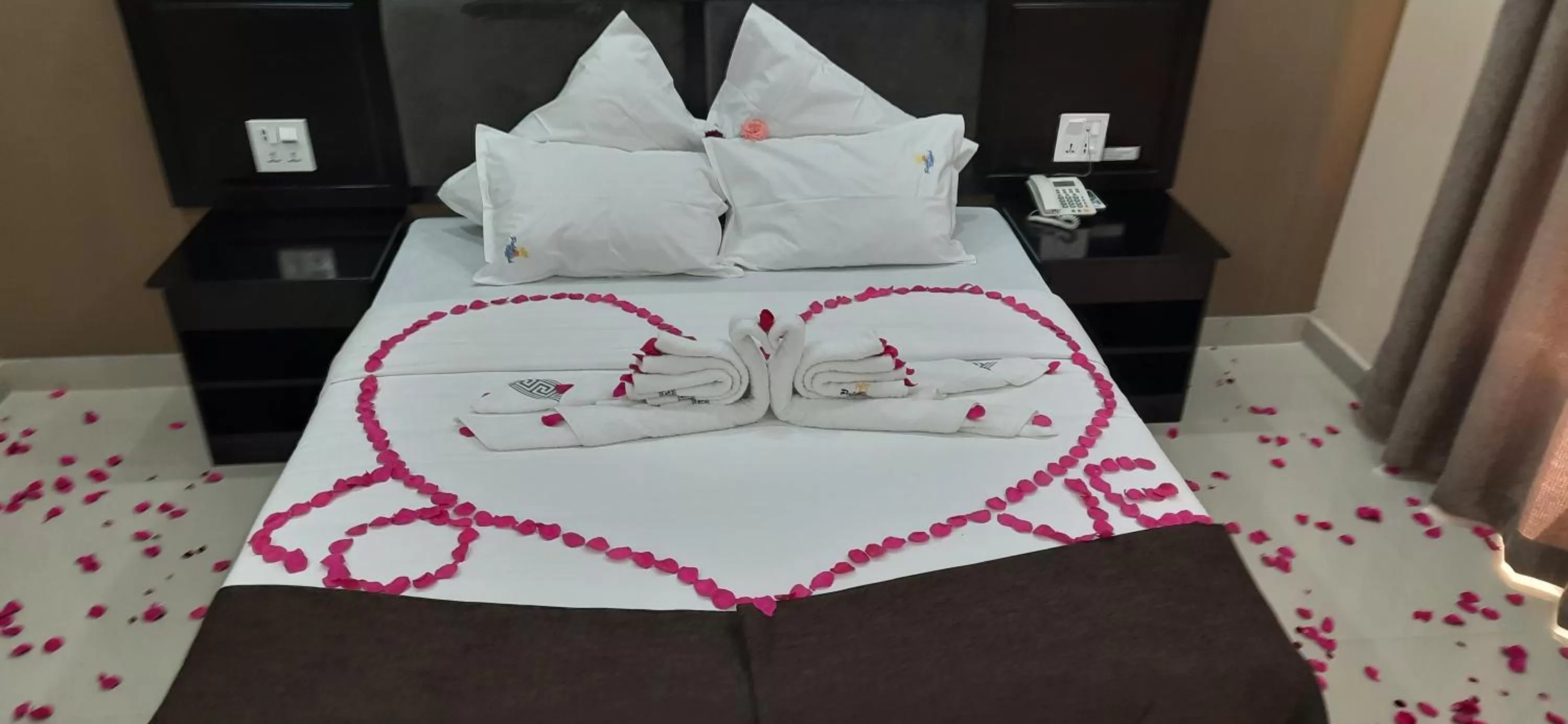 Bed in Palm Kalash Hotel