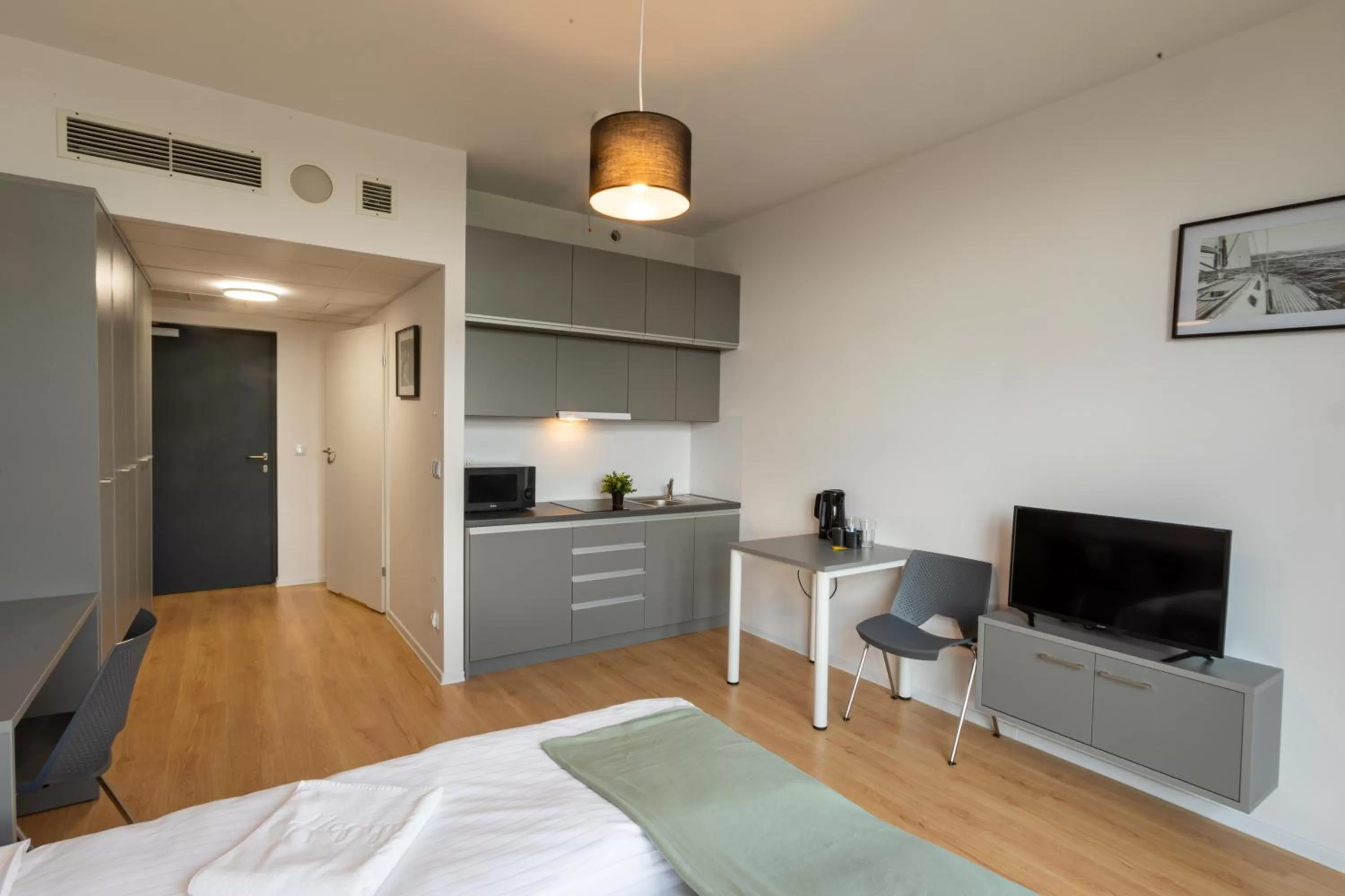 Bed in SleepWell Apartments