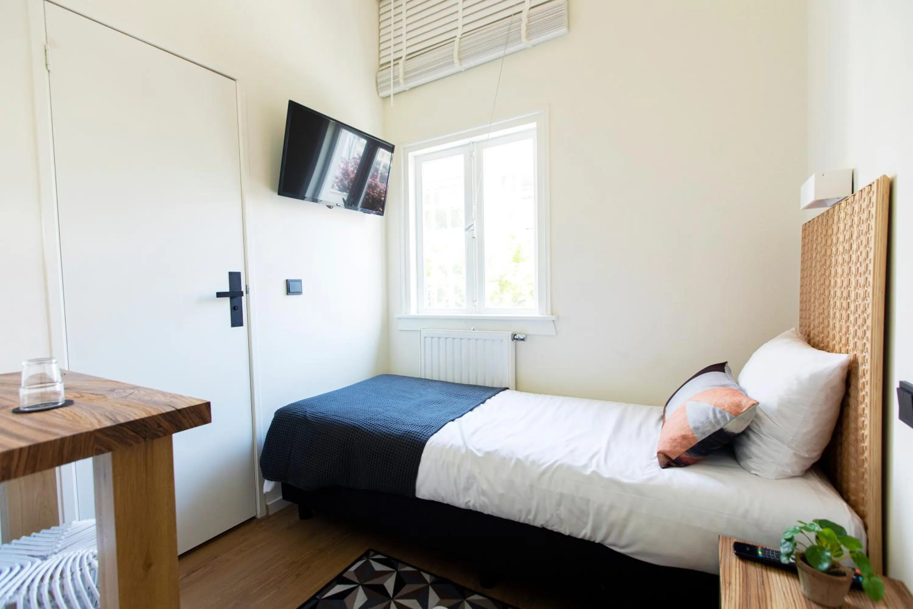 Bed in Quentin Golden Bear Hotel