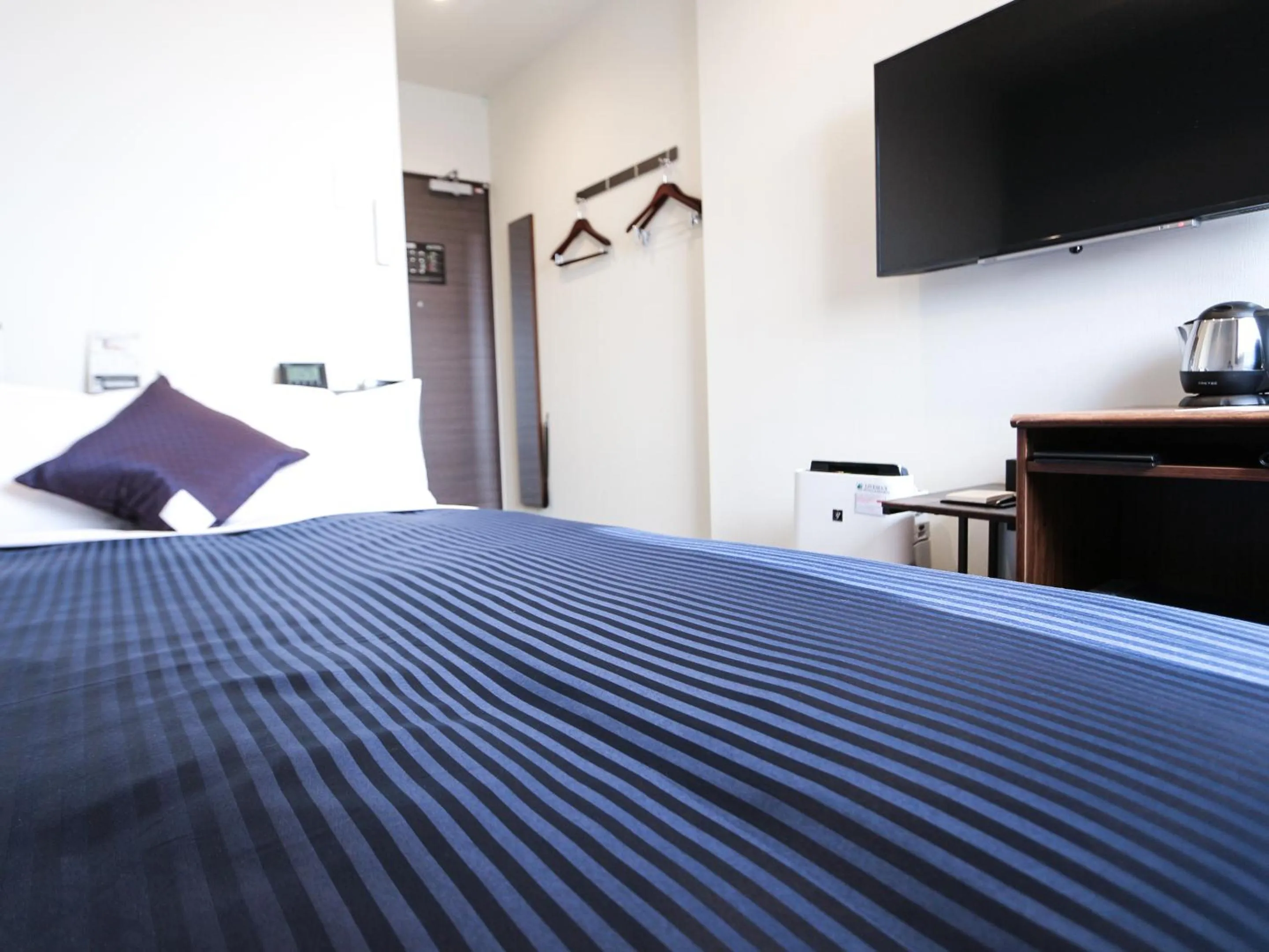 Bed in HOTEL LiVEMAX Tokyo Ayase-Ekimae