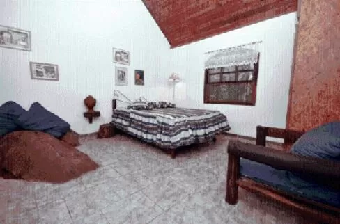 Bed in Pousada A Marca do Faraó