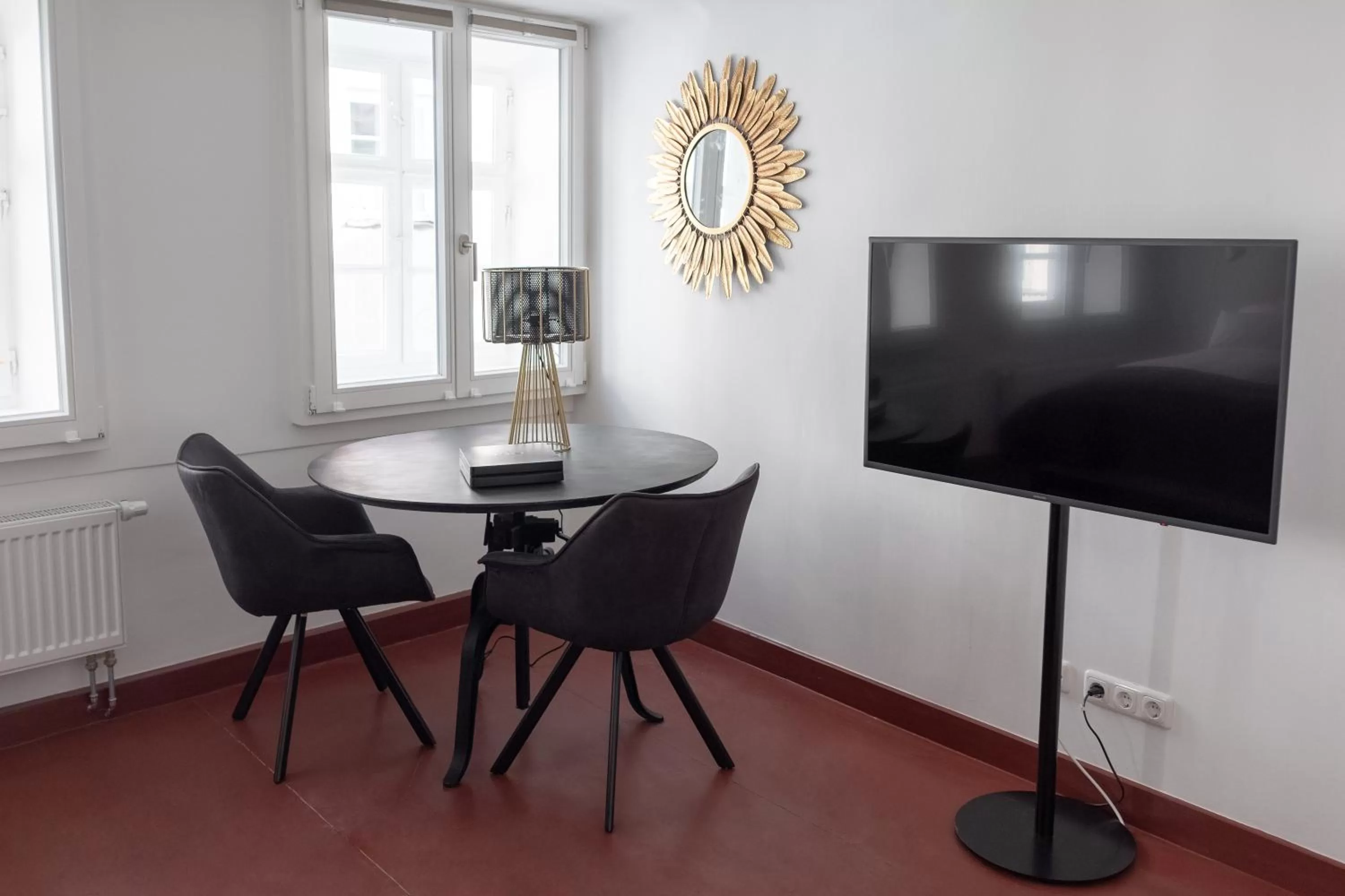 Seating area in ANA Living Augsburg City Center by Arthotel ANA - Self-Service-Hotel