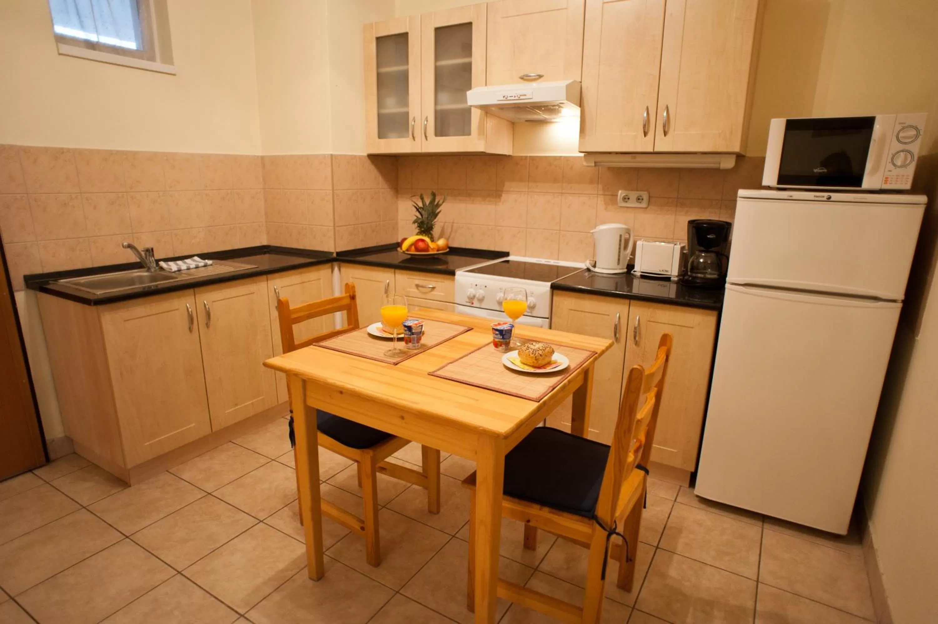 Kitchen or kitchenette in Agape Apartments