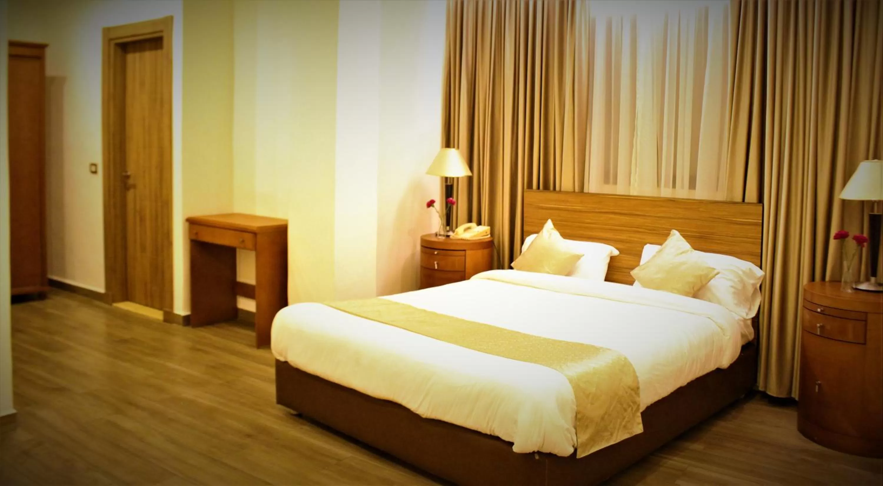 Bed in New MerryLand Hotel