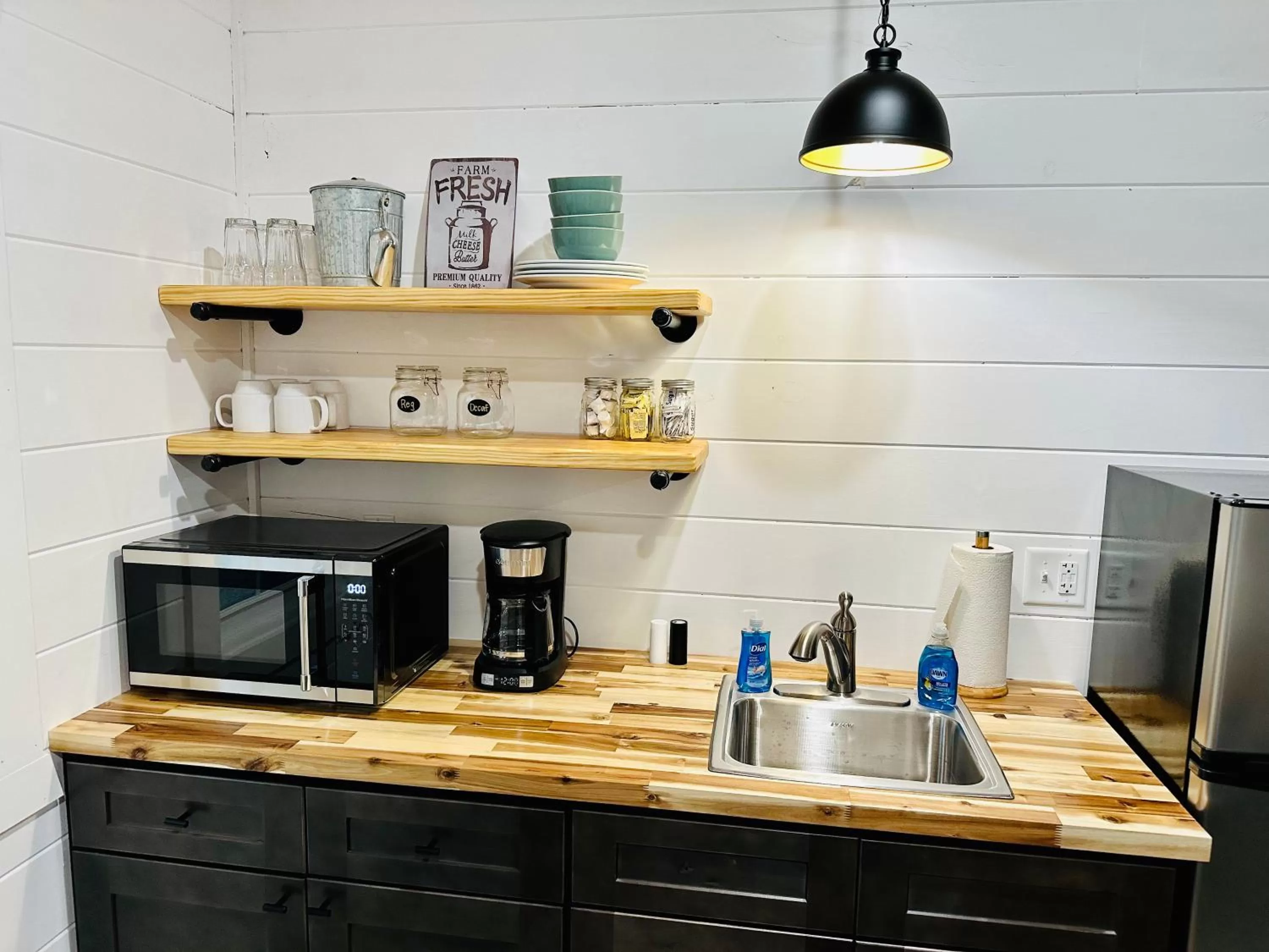 Kitchen or kitchenette in Knotty Squirrel Cabins