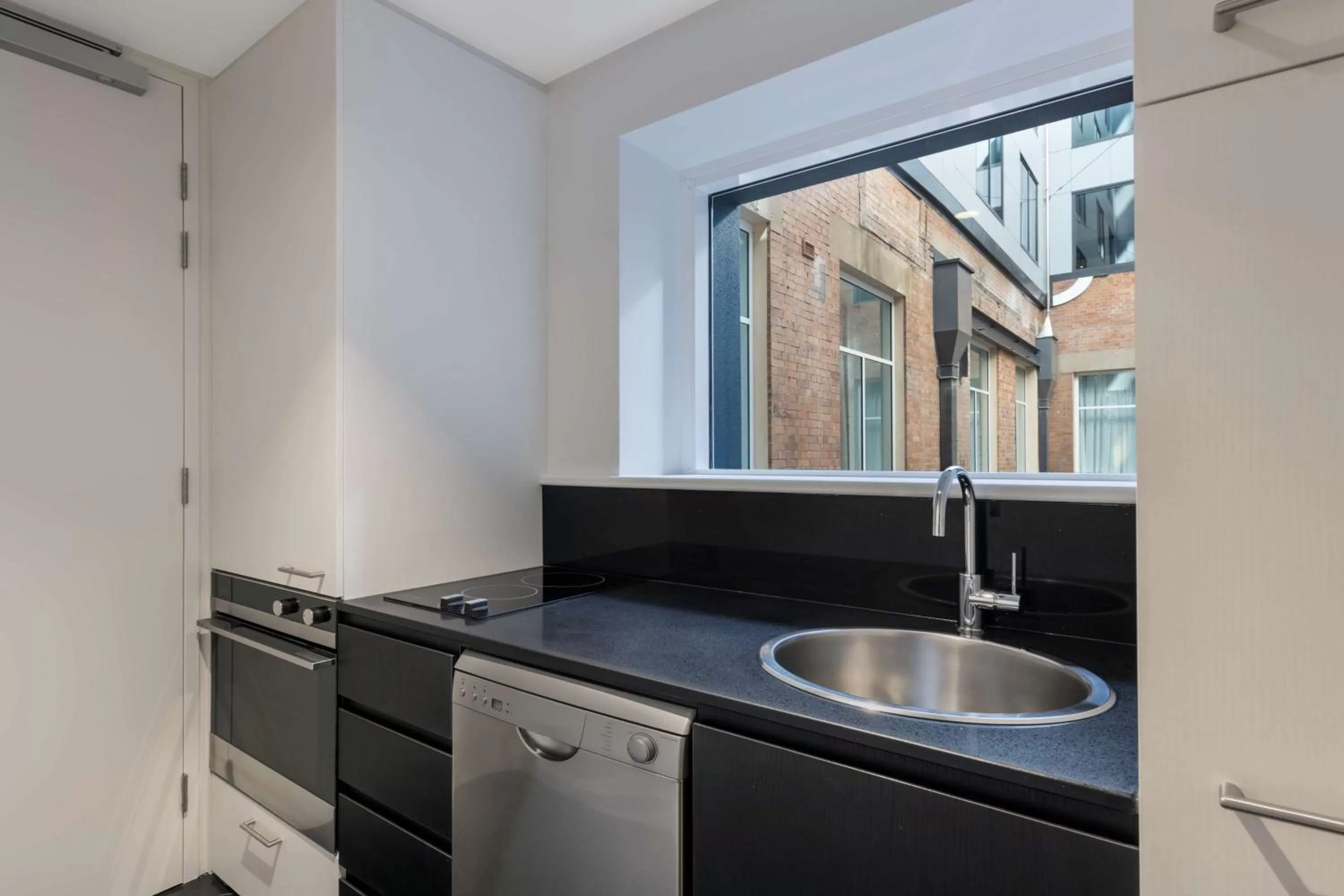 Kitchen or kitchenette in Adina Apartment Hotel Brisbane