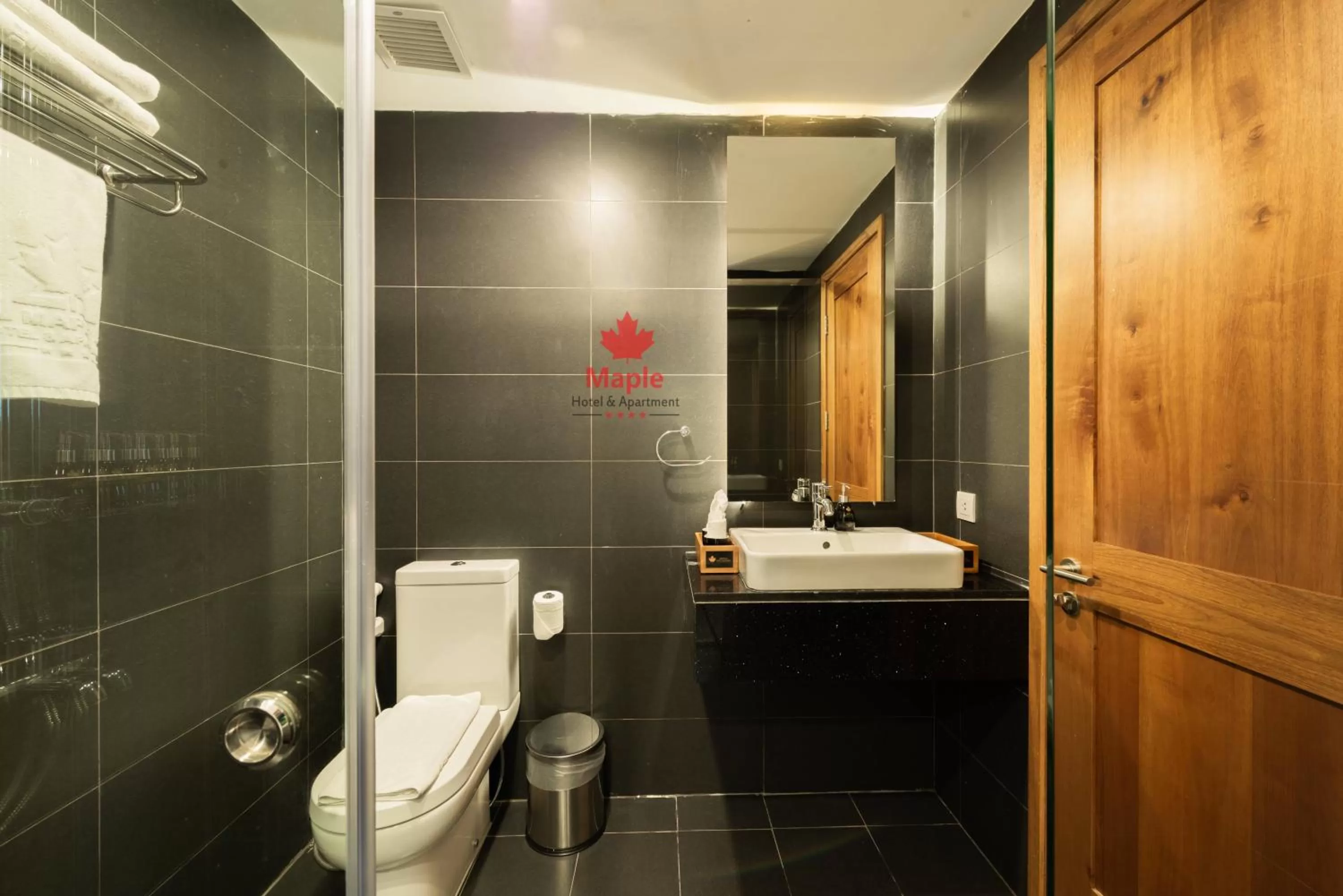 Toilet in Maple Hotel & Apartment