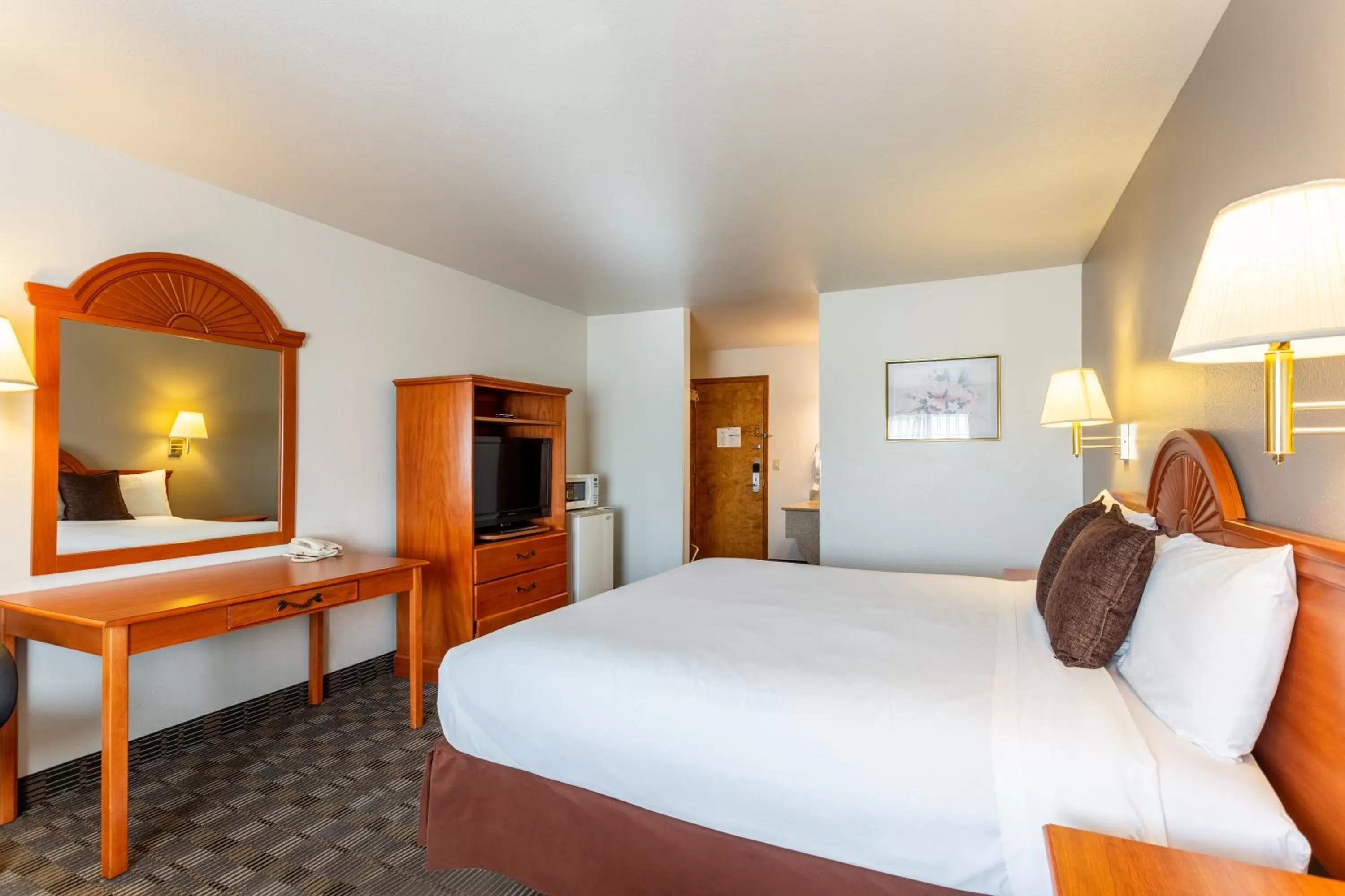 Bed in Americas Best Value Inn Burns