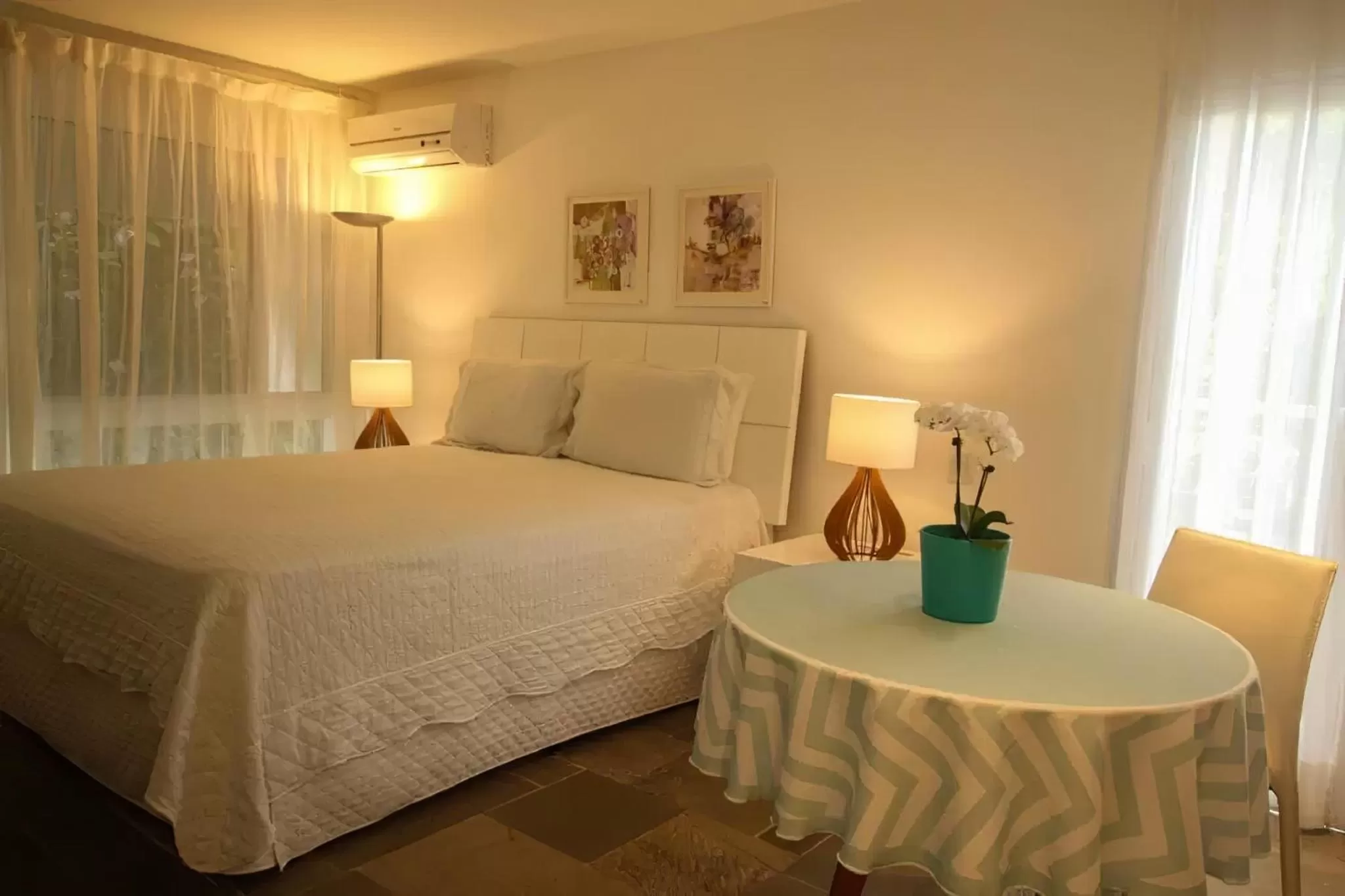 Bed in Guest House Guarujá