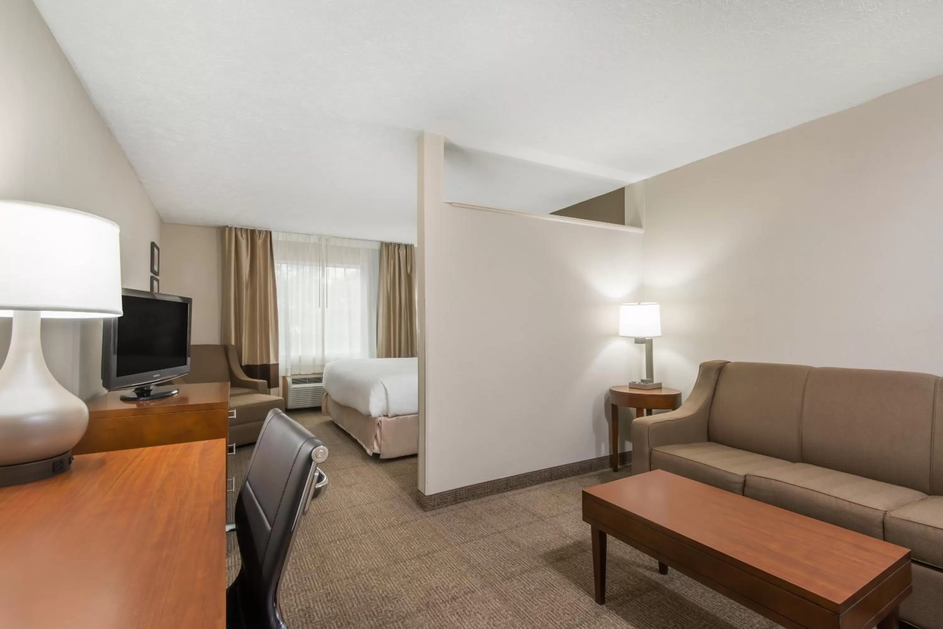 Seating area, Bed in Wyndham Garden Hotel Cross Lanes Charleston