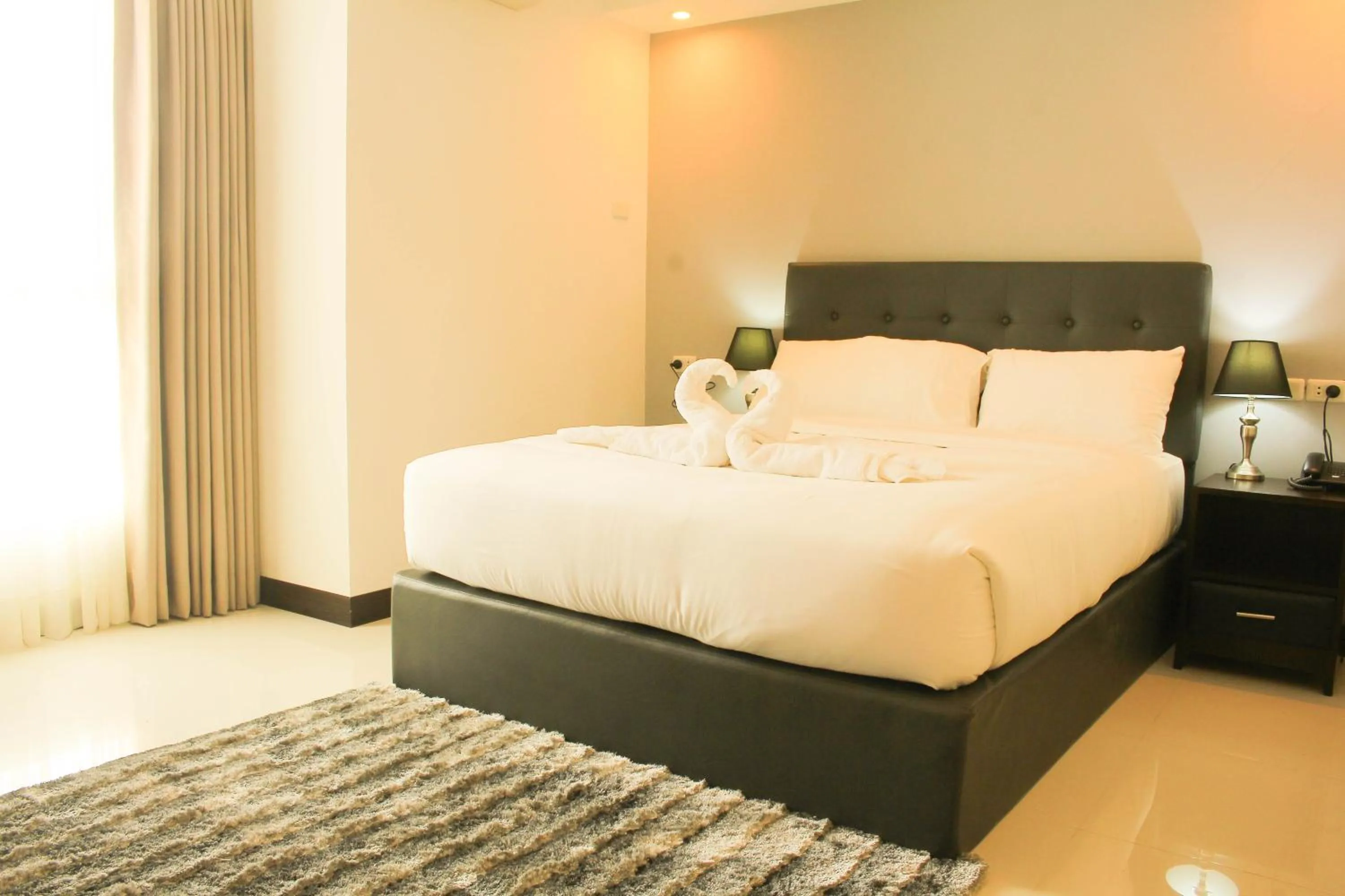 Bed in The Pacifico Boutique Hotel