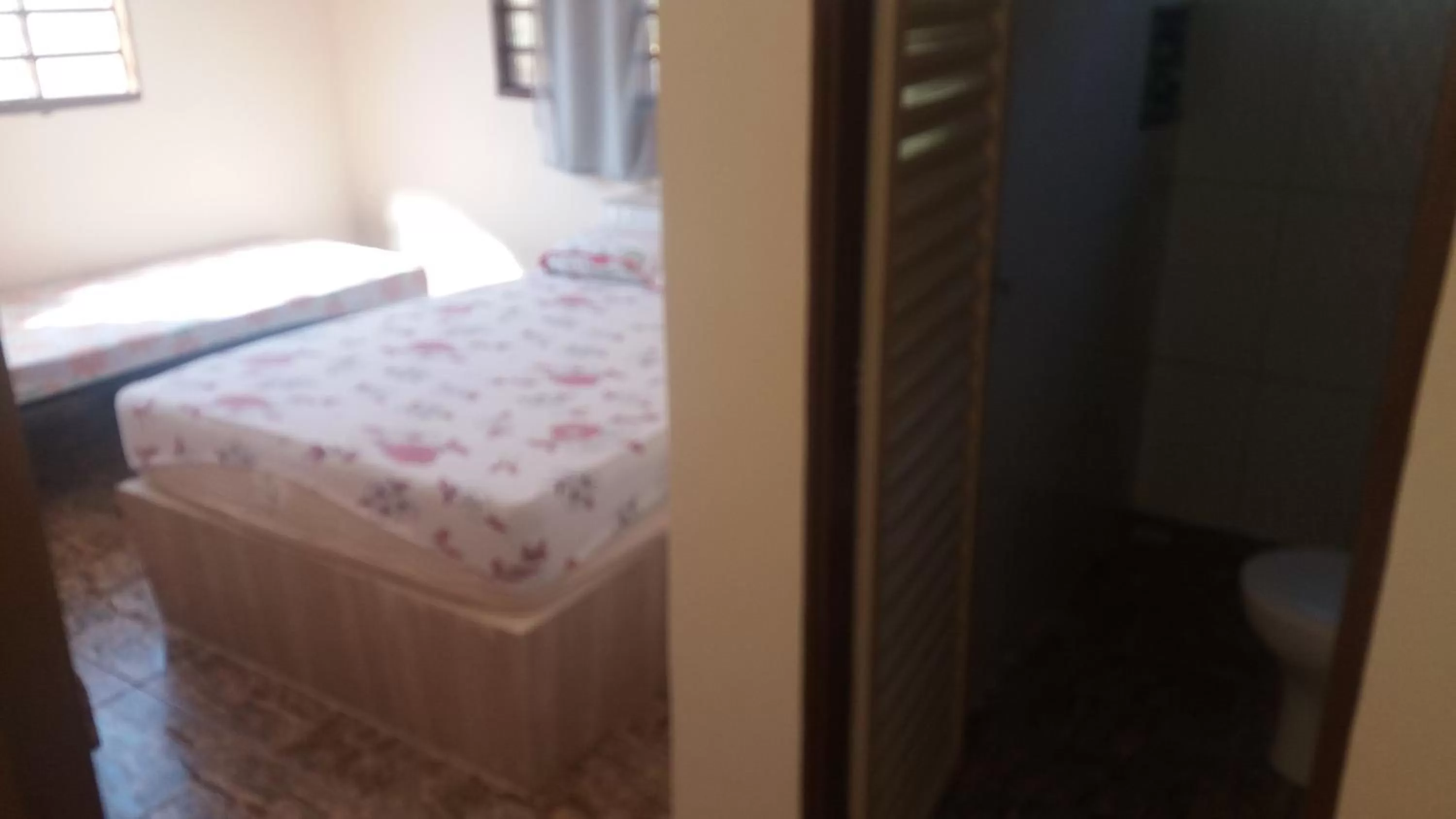 Bed in ApartHotel Família Meireles