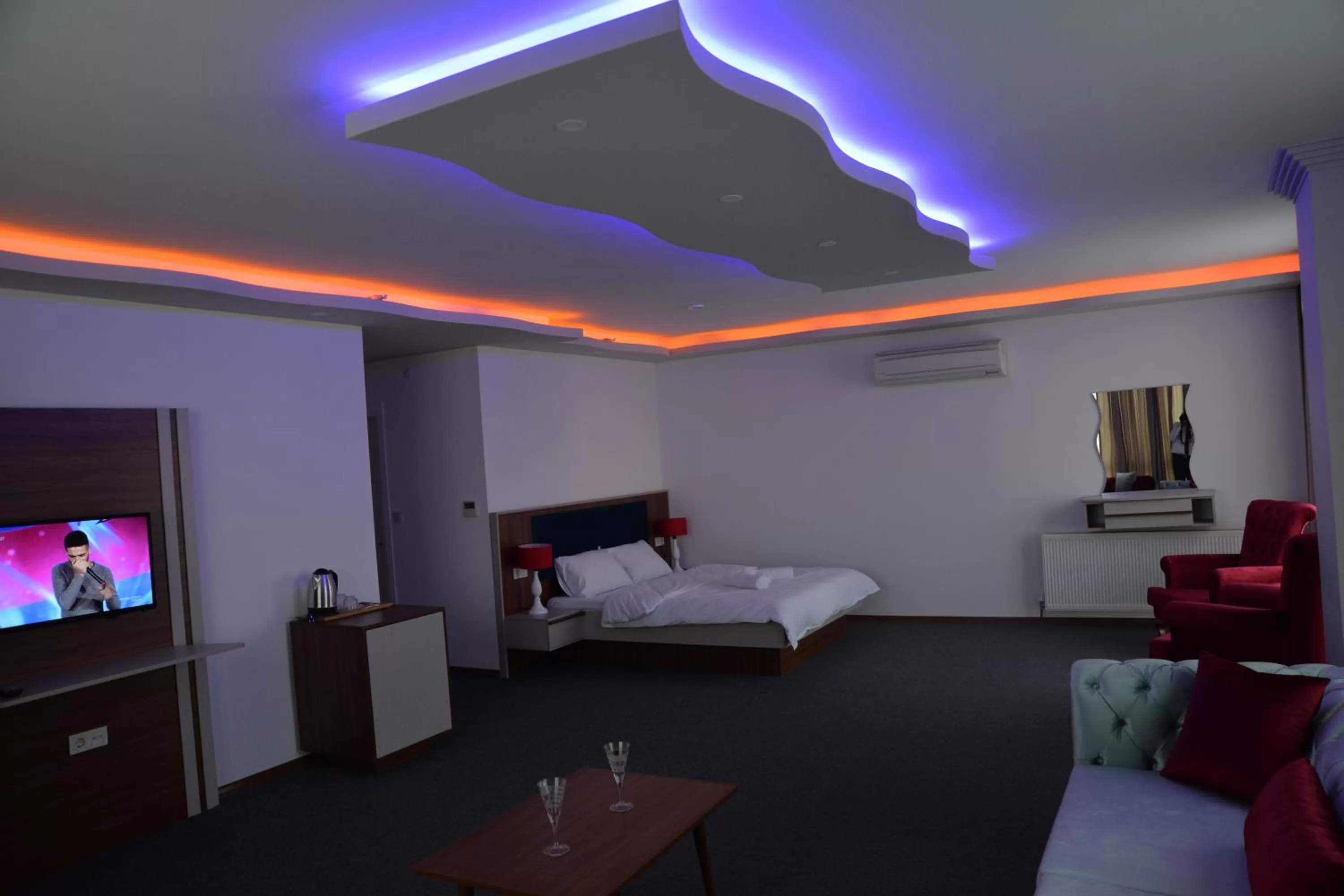 Bed in TEVETOGLU HOTEL