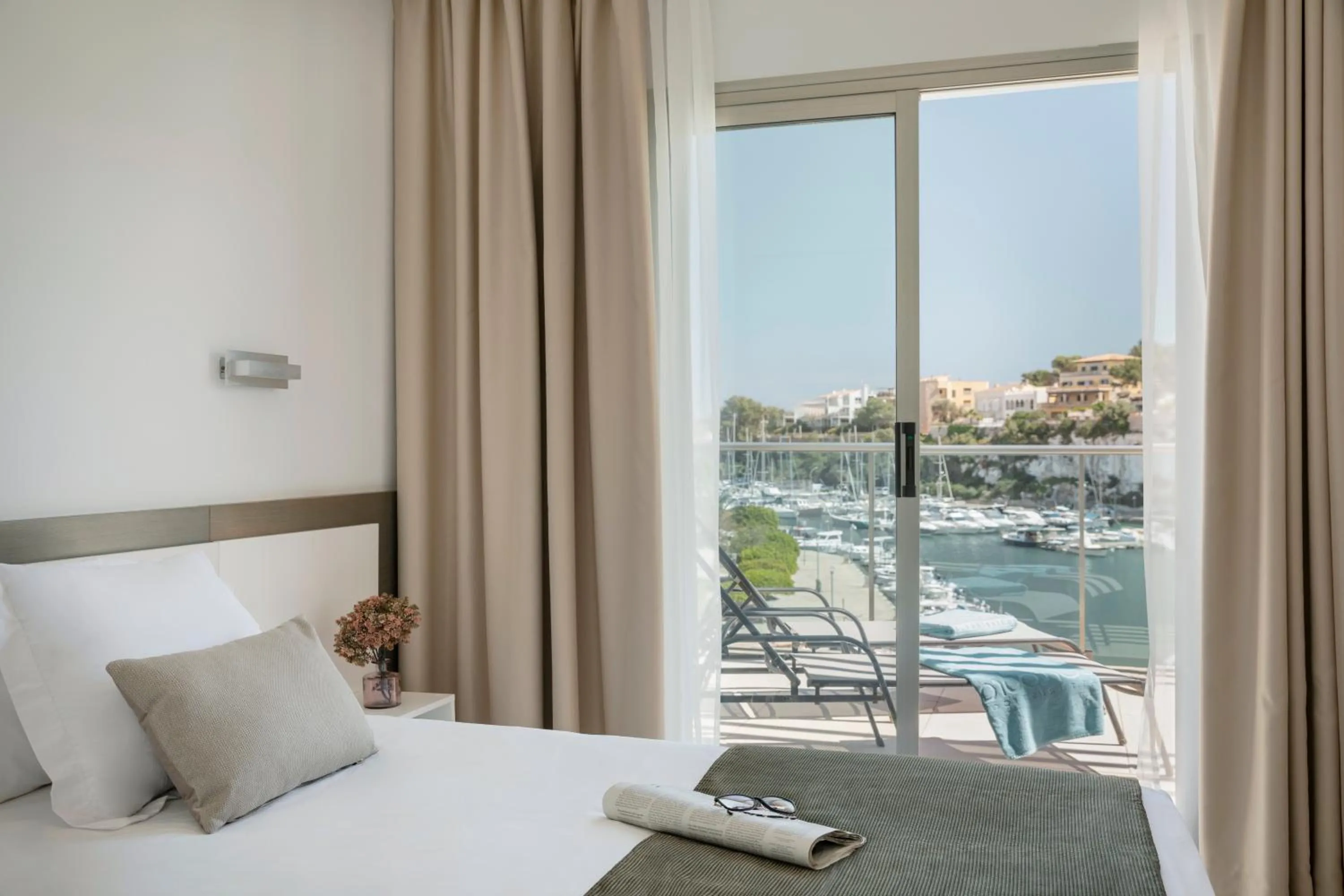 Bed in Porto Drach Aparthotel & Suites