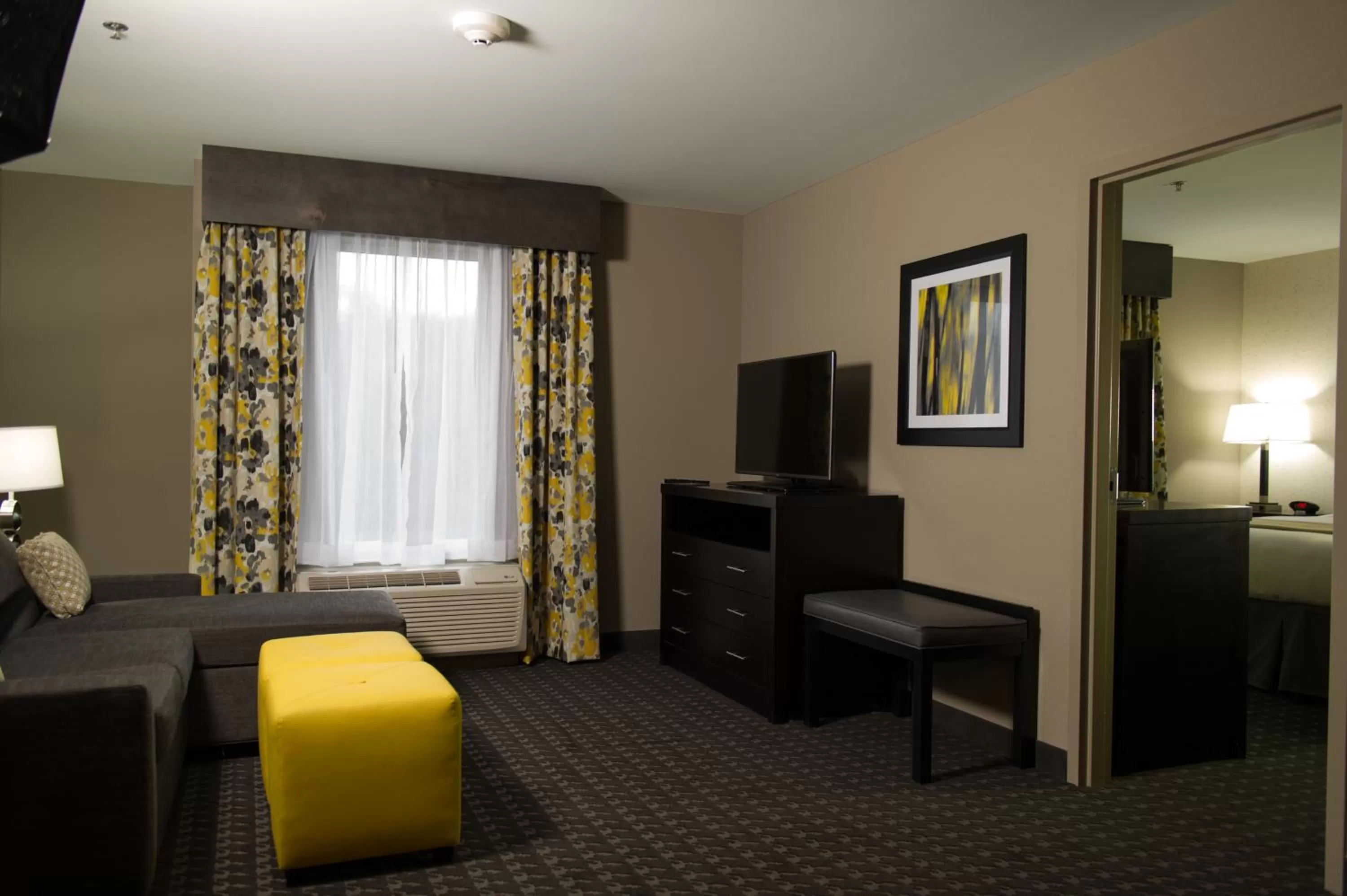 Living room, Bed in Holiday Inn Express and Suites Madison Central by IHG
