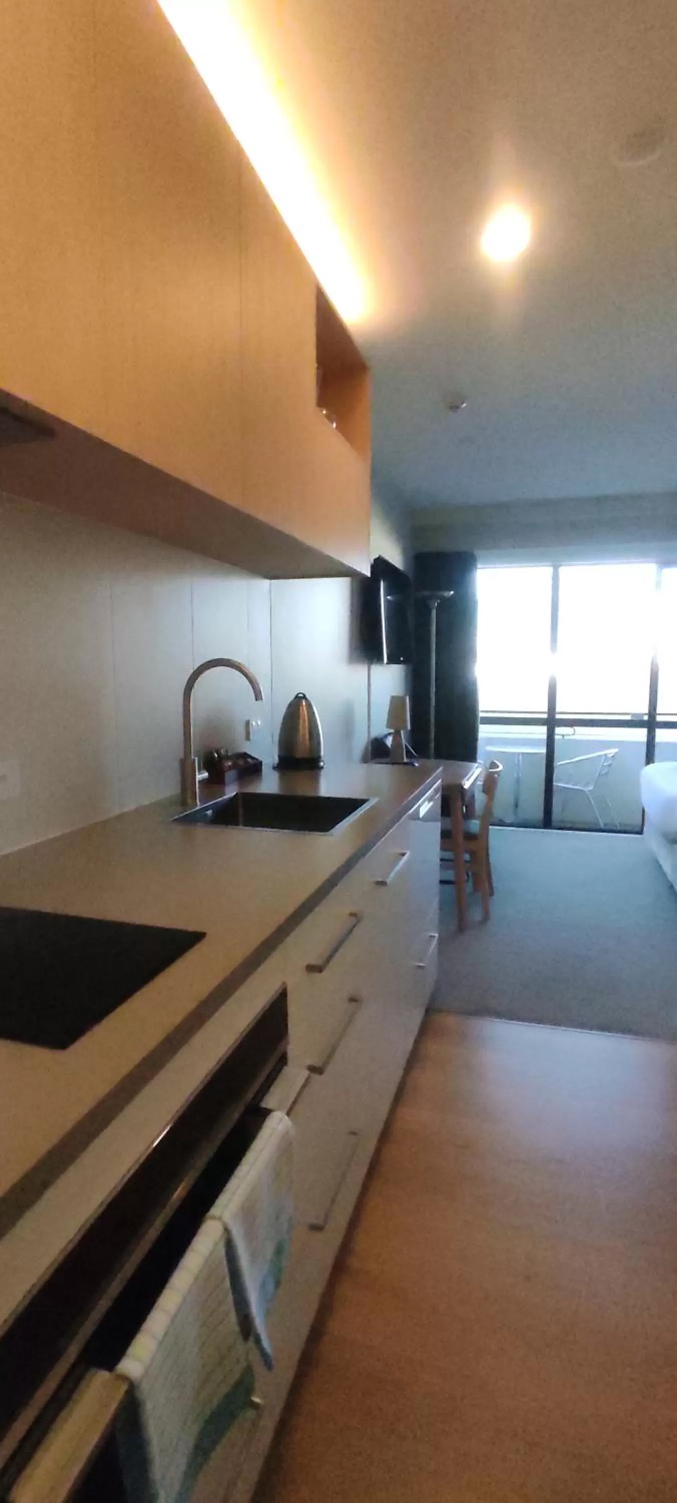 Kitchen or kitchenette in West Fitzroy Apartments