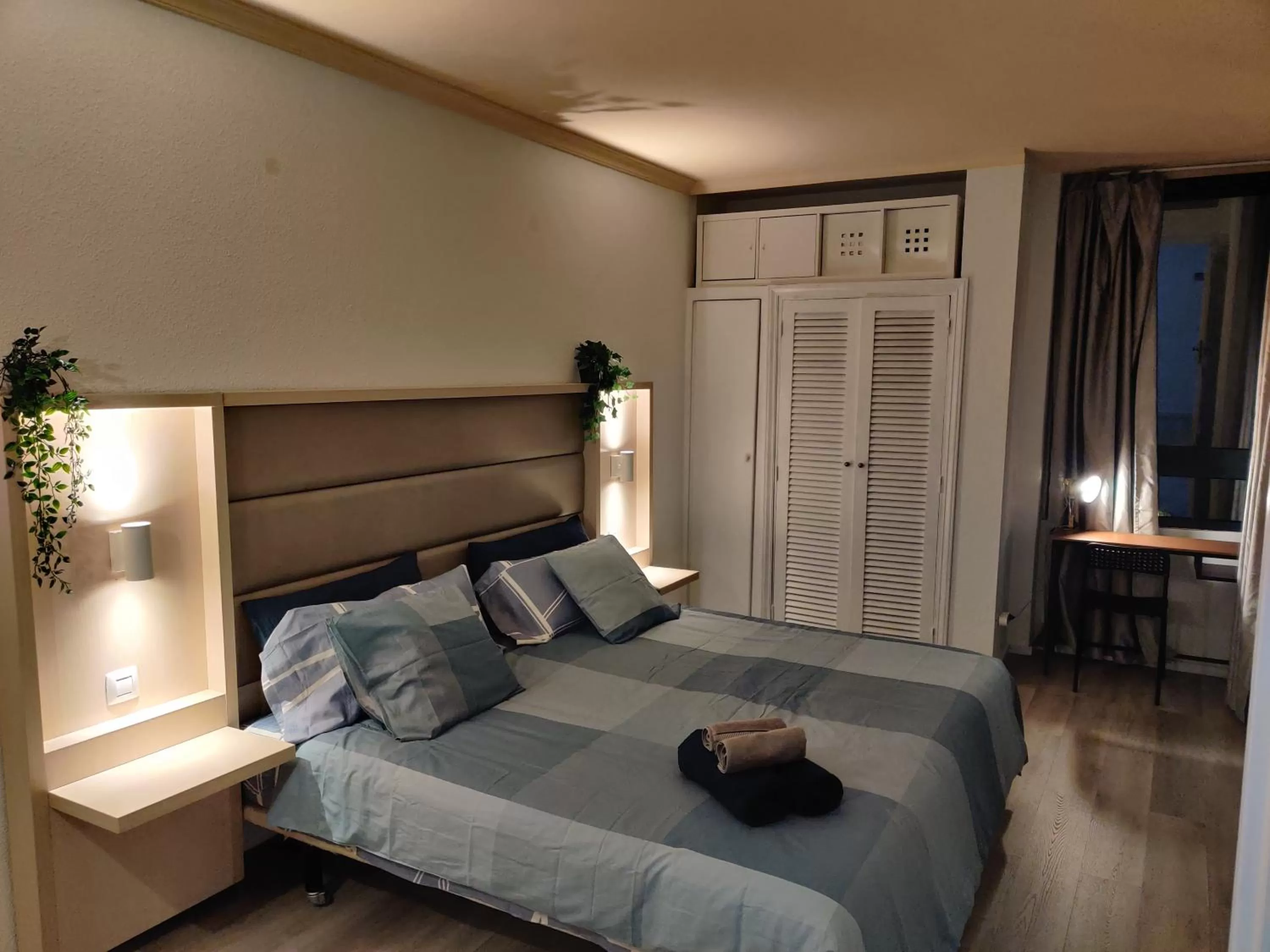 Bed in Luxury Apartment with pool view