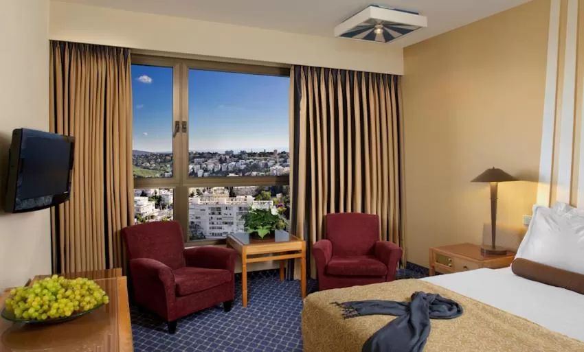 Bed in Dan Panorama Haifa Hotel