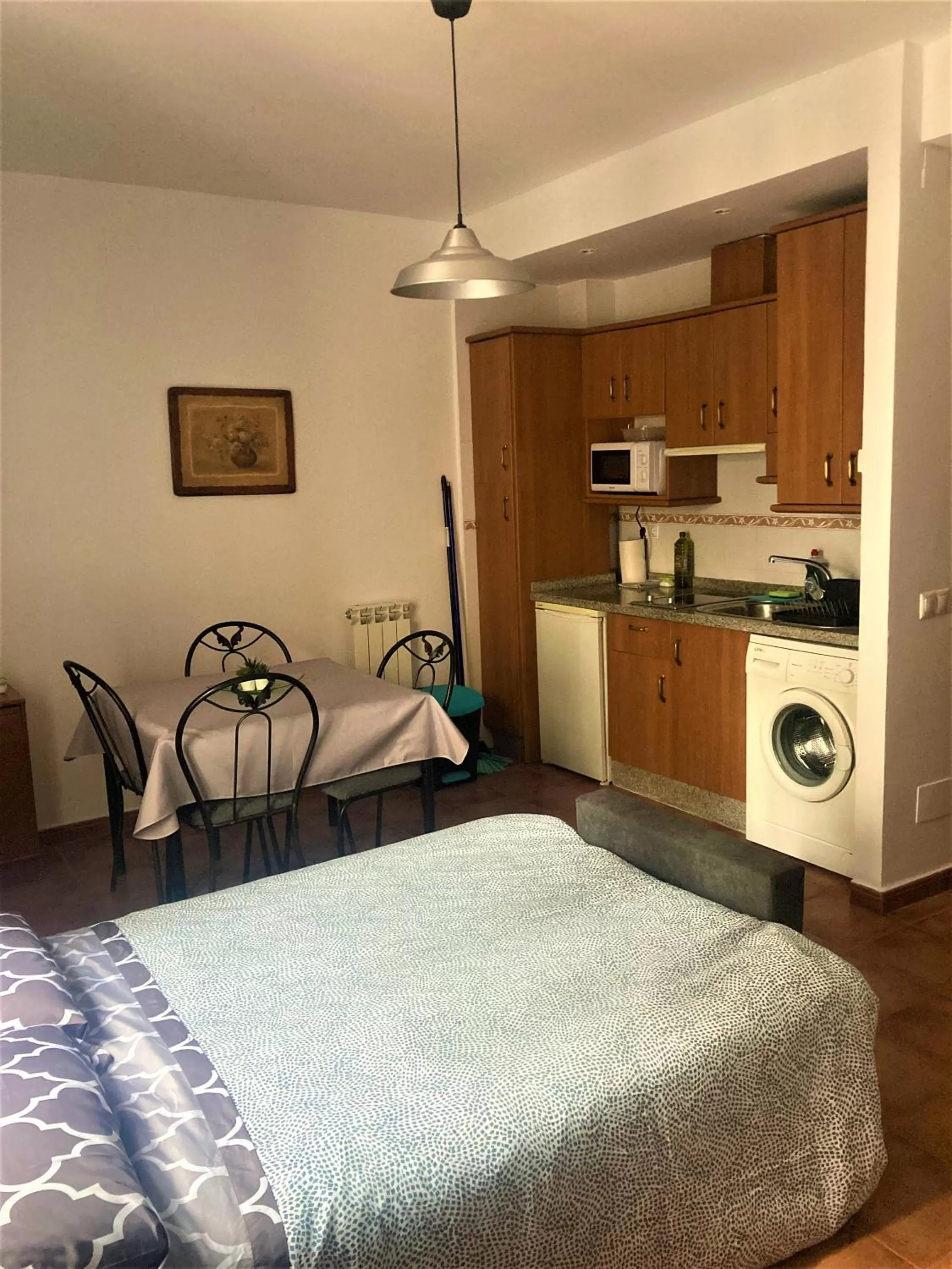 Kitchen or kitchenette, Bed in APARTAMENTOS CASERIA DE COMARES