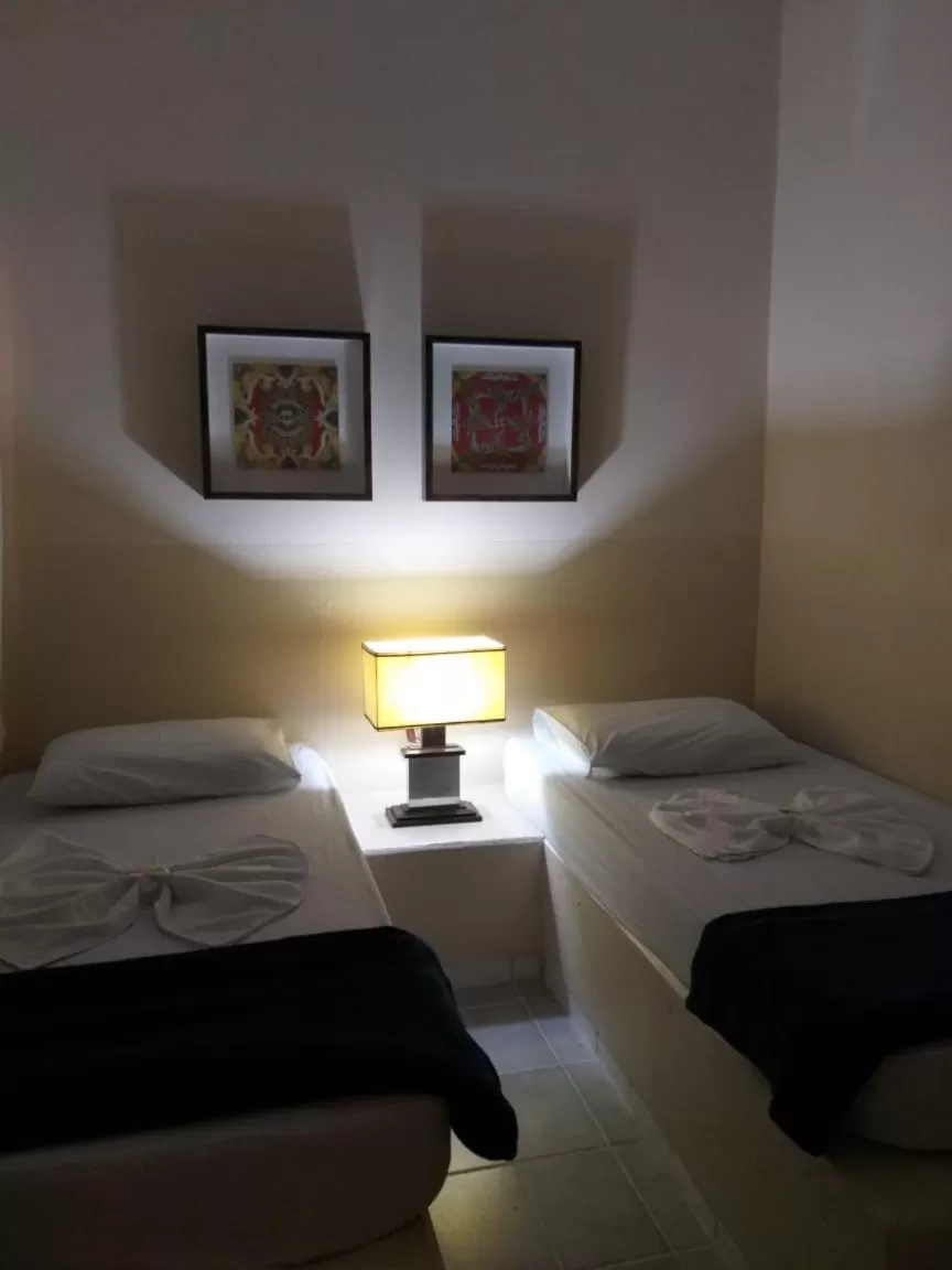 Bed in Pousada Dois Rios