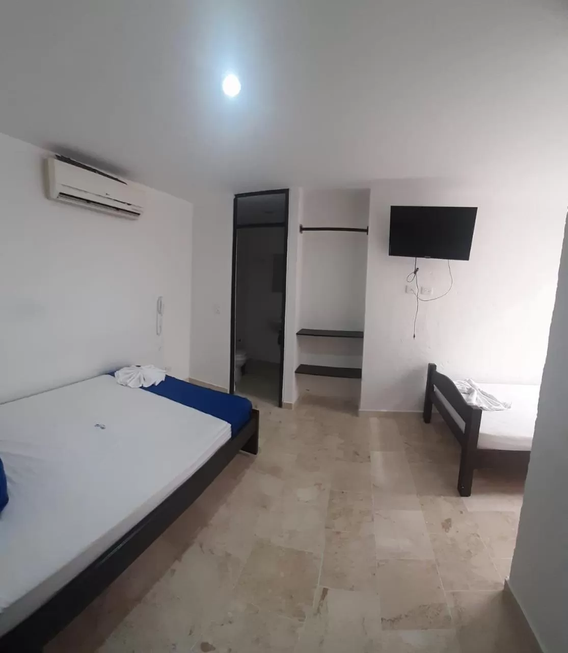 Bed in Blue Star Hotel