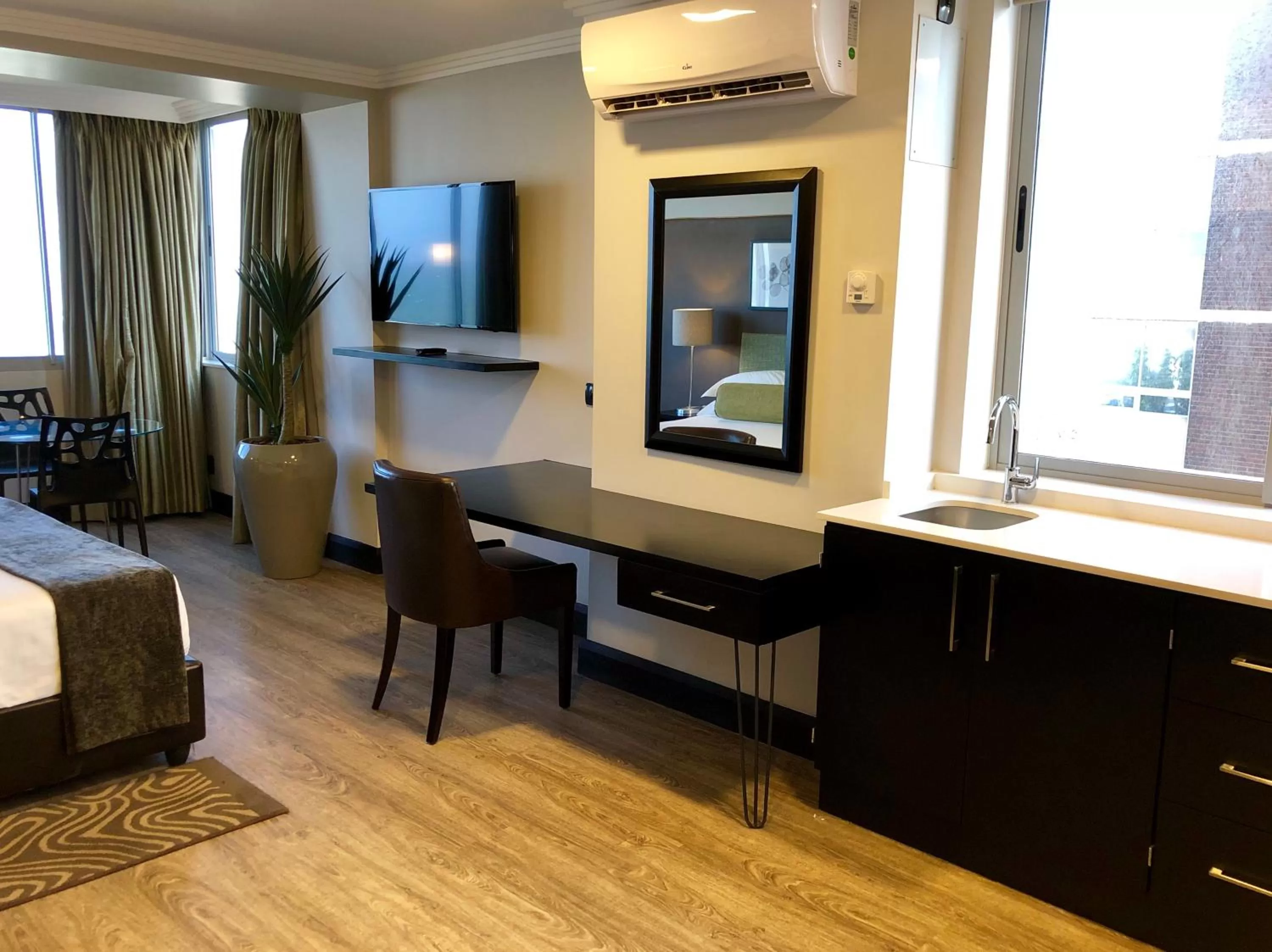 Bedroom in Belaire Suites Hotel