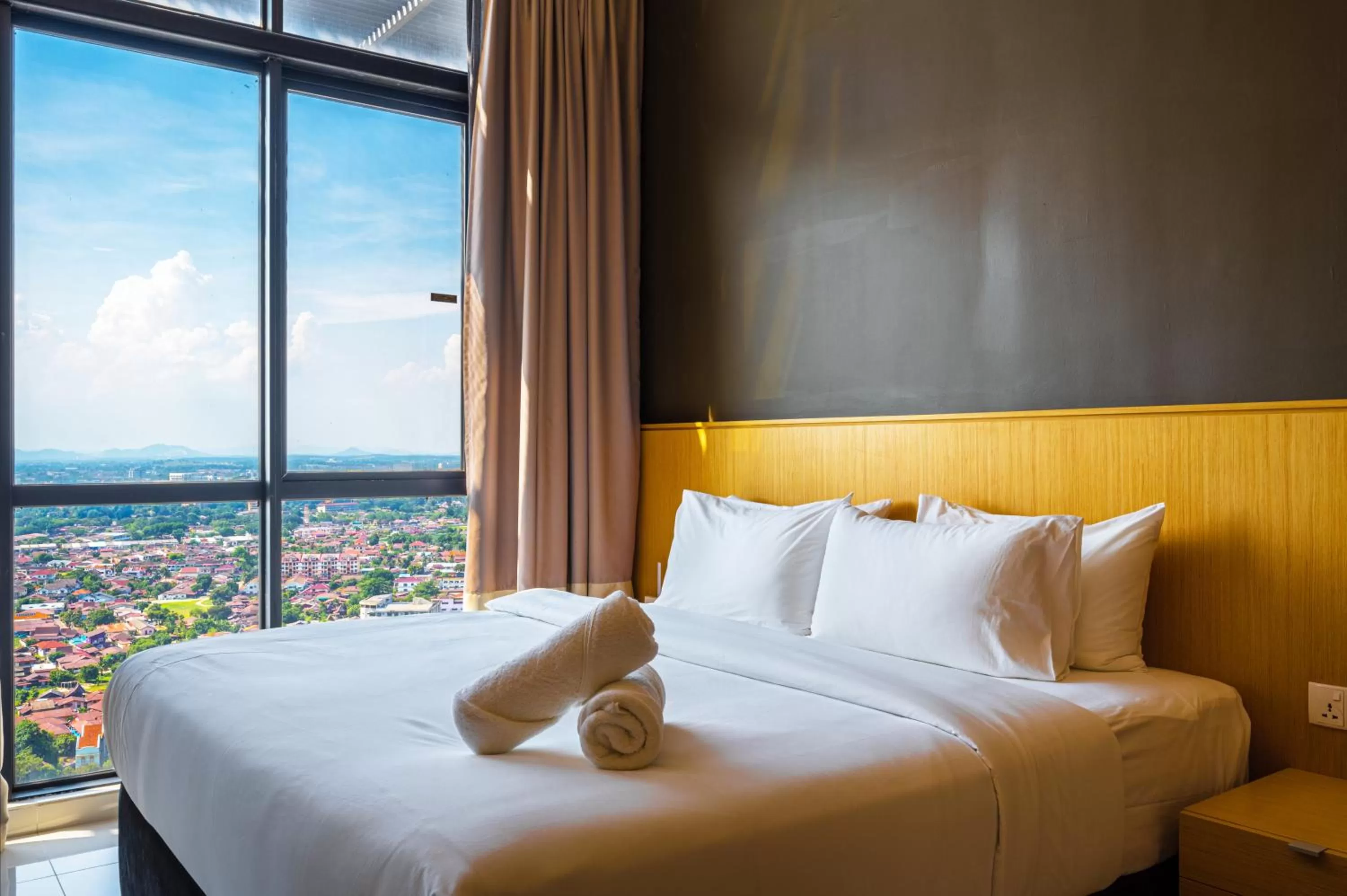 Bed in Greystone 99 Suites