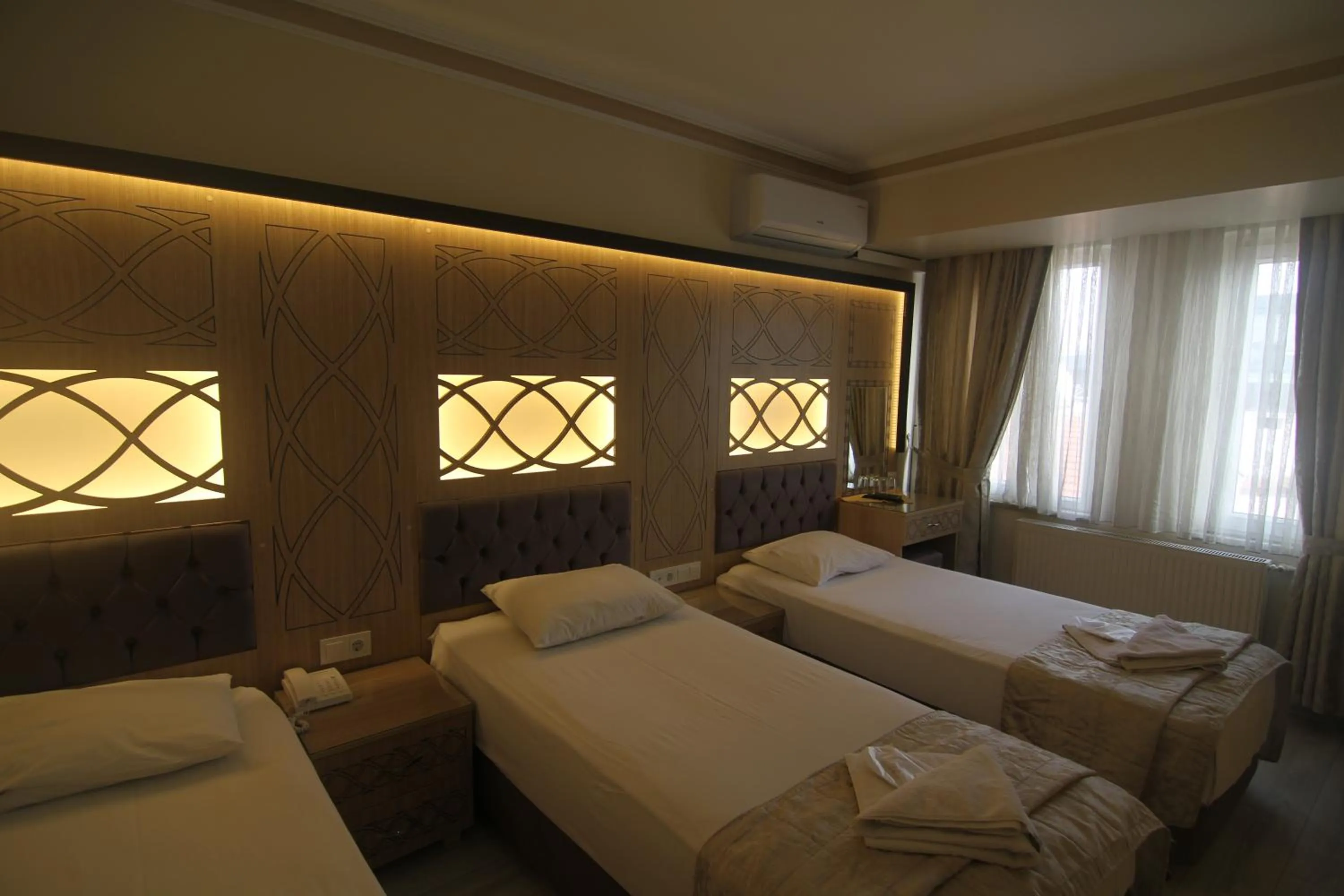 Bedroom, Bed in Grand Liza Hotel