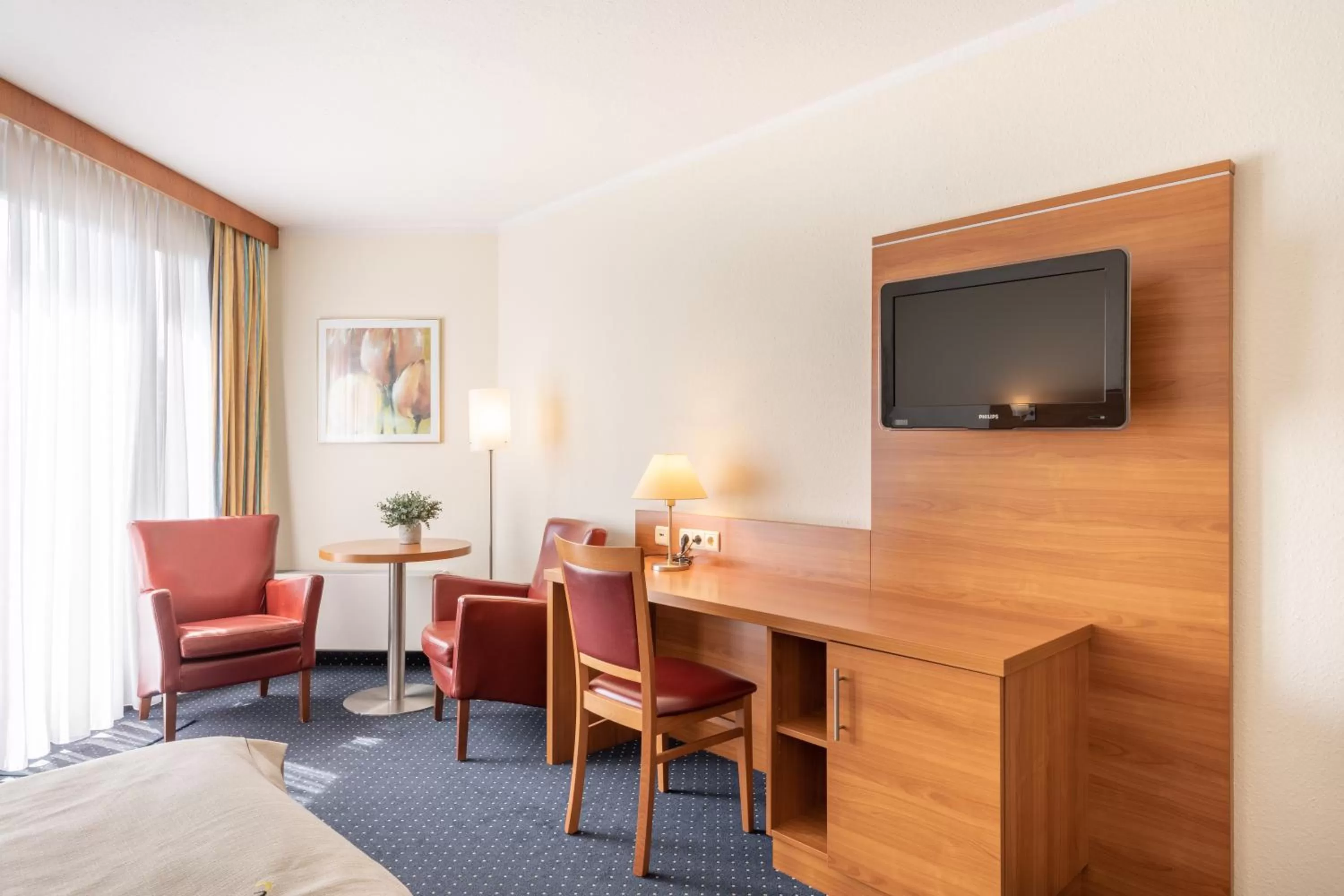 Bed, TV/Entertainment Center in acora Bochum Living the City