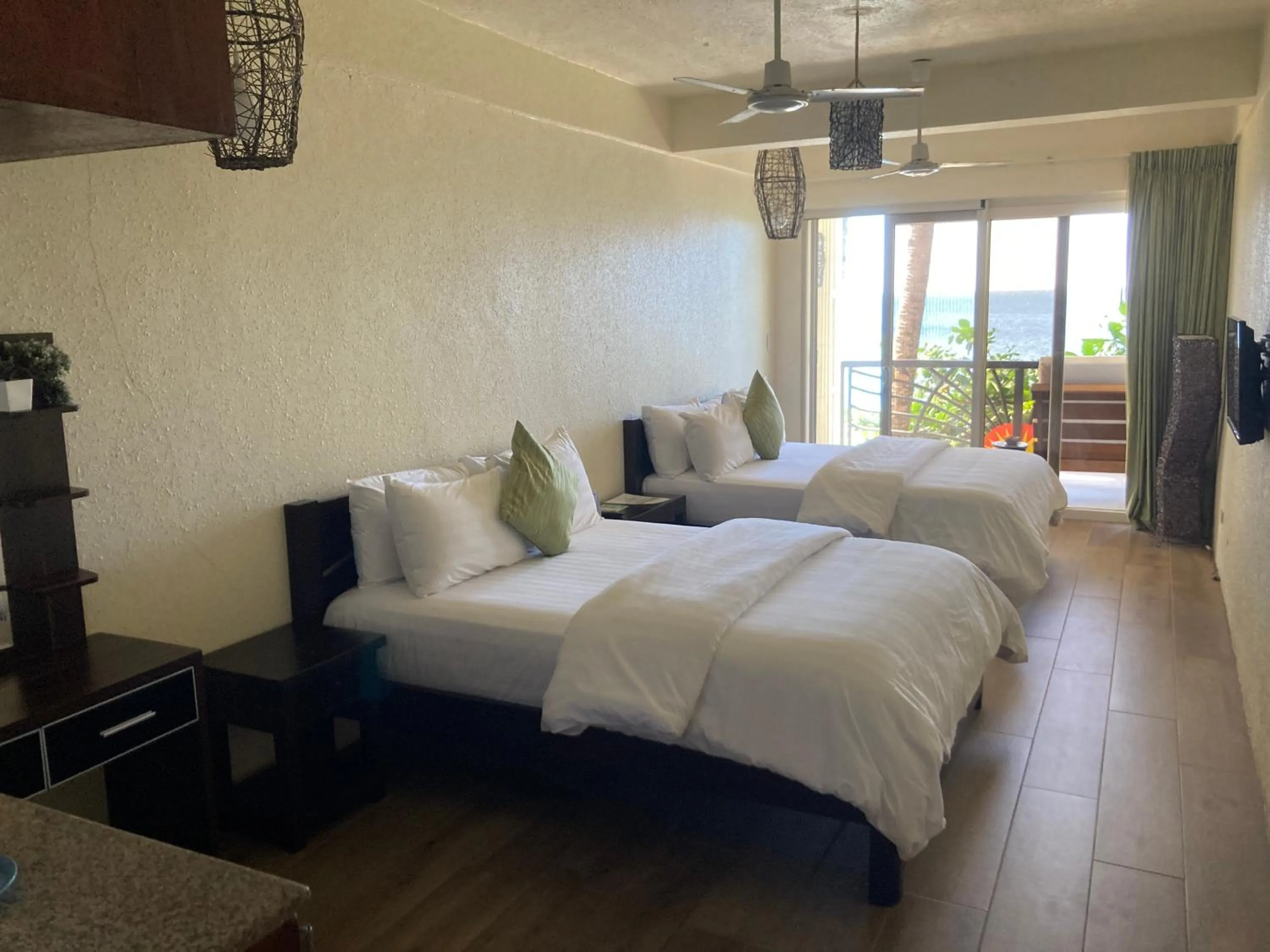 Photo of the whole room, Bed in Sunset At Aninuan Beach Resort