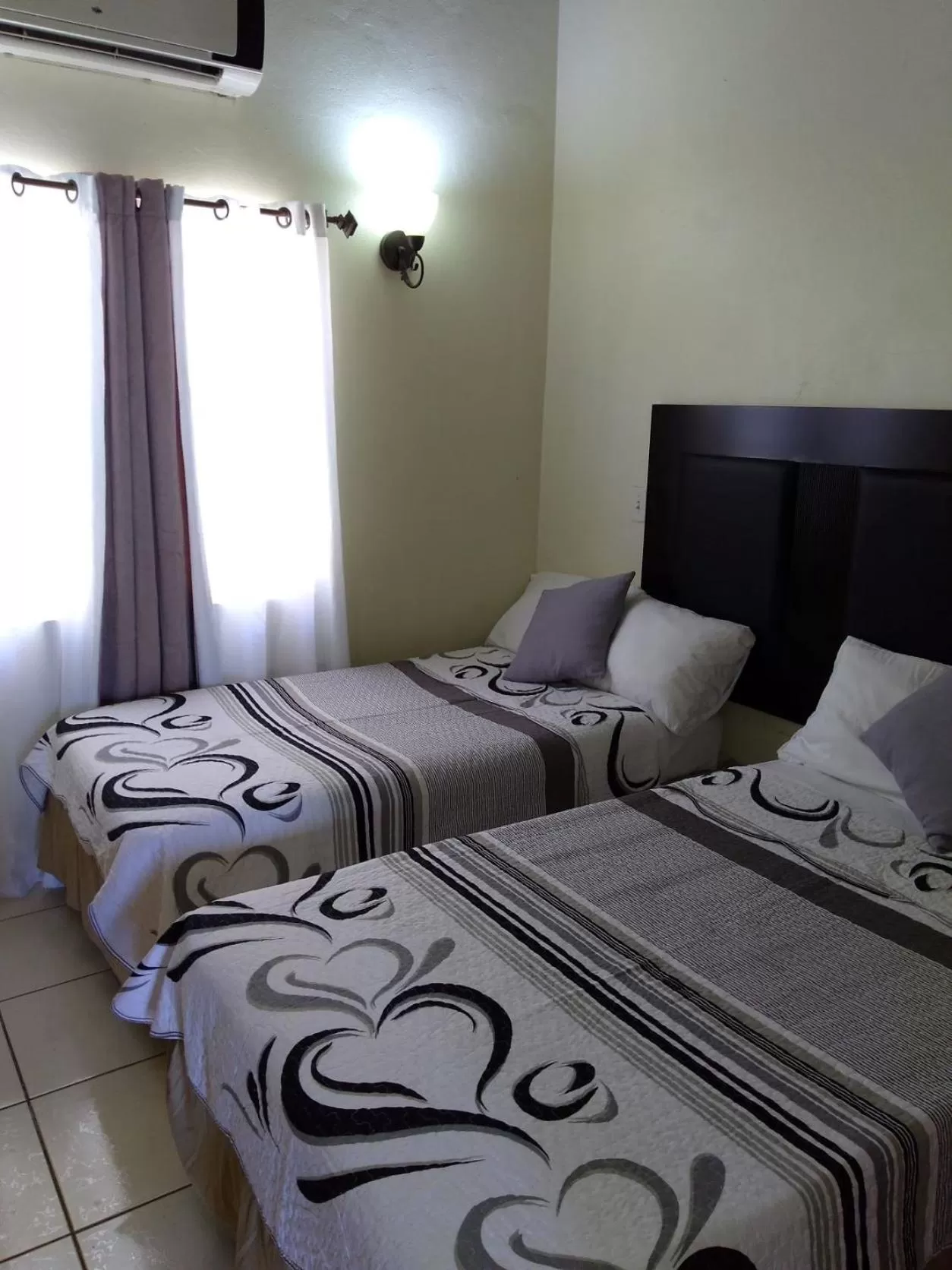 Bed in Connie's Comfort Suites