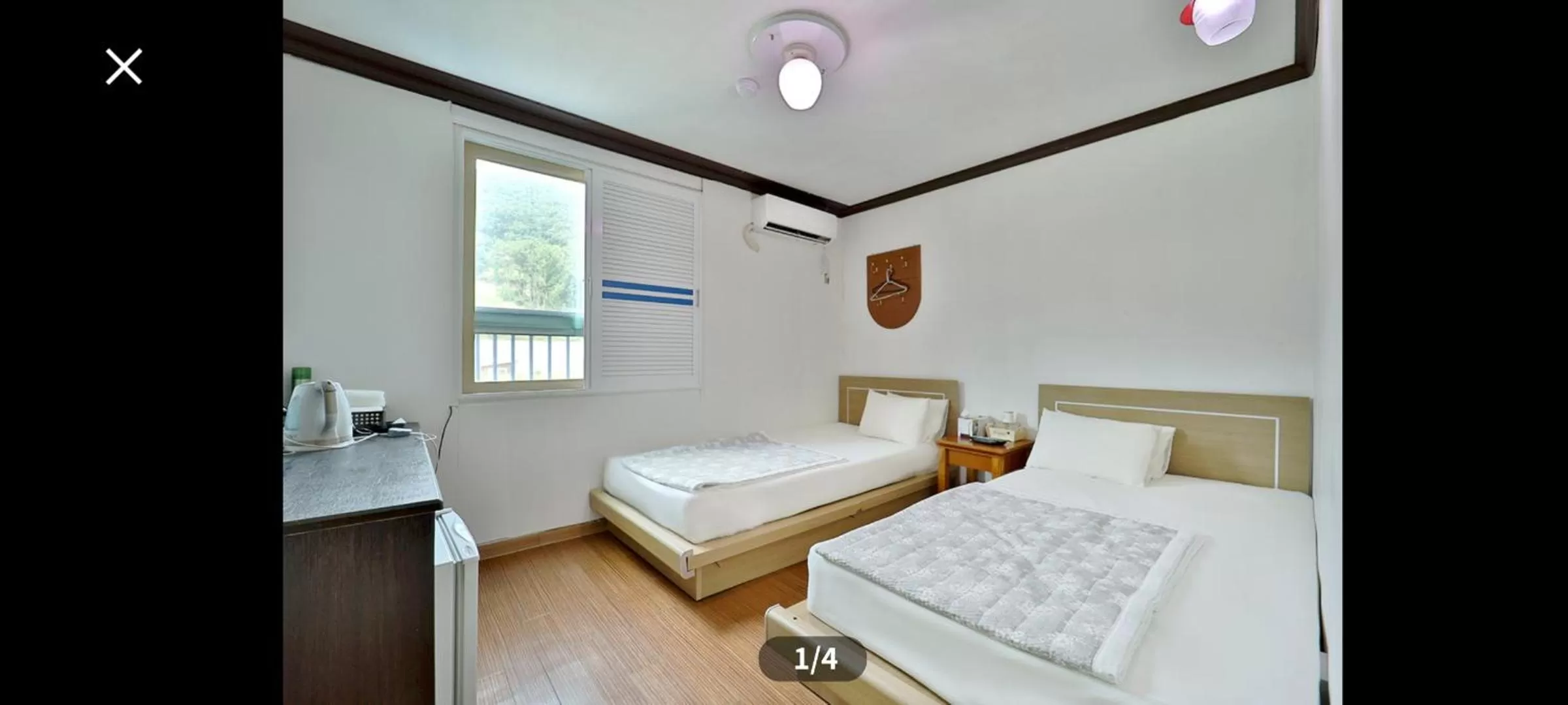 Bed in Saipan Motel with Sea View