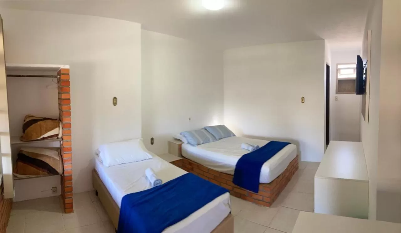 Bed in Pousada Marinamarela