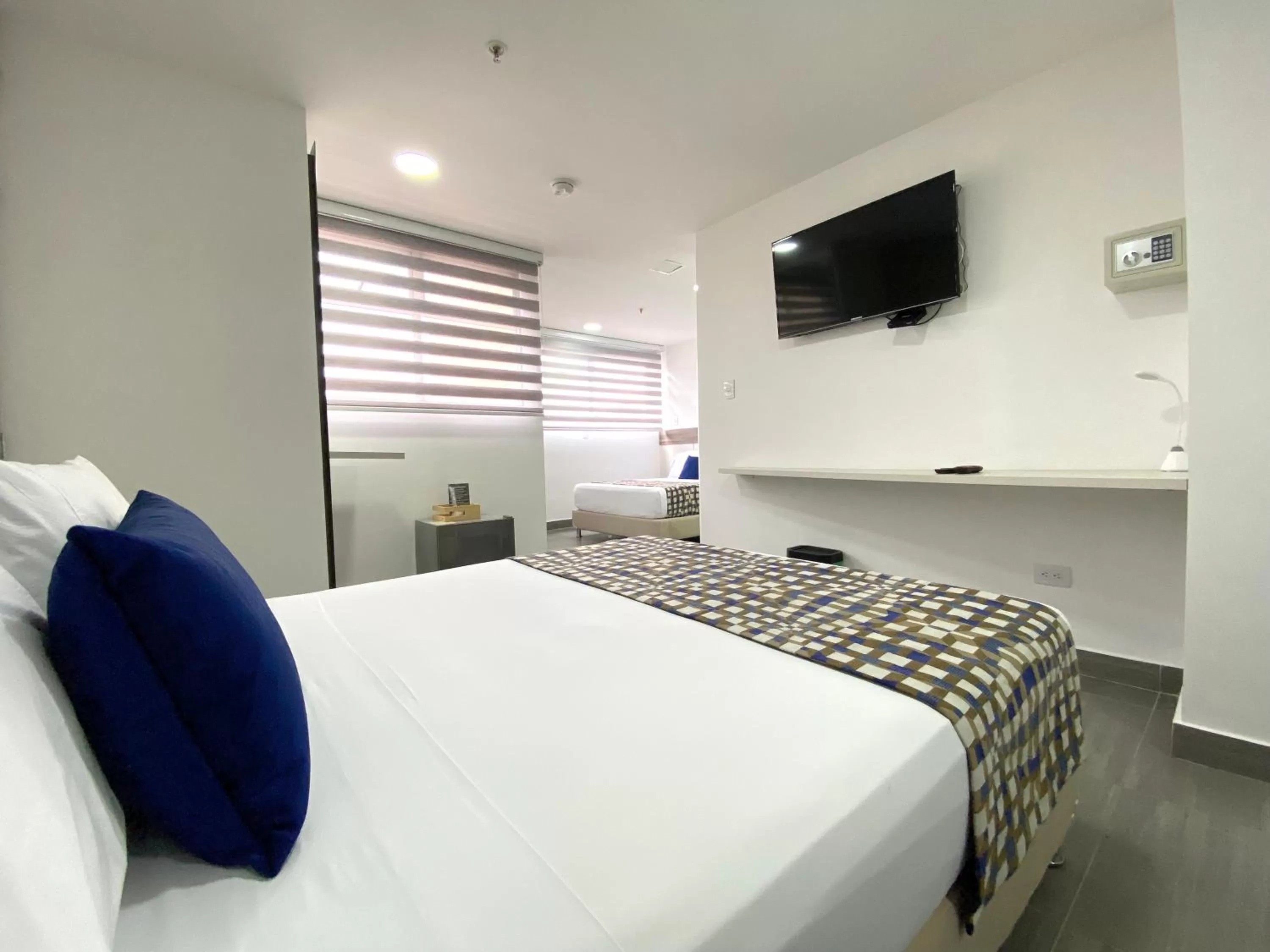 Communal lounge/ TV room, Bed in Seven Inn Hotel