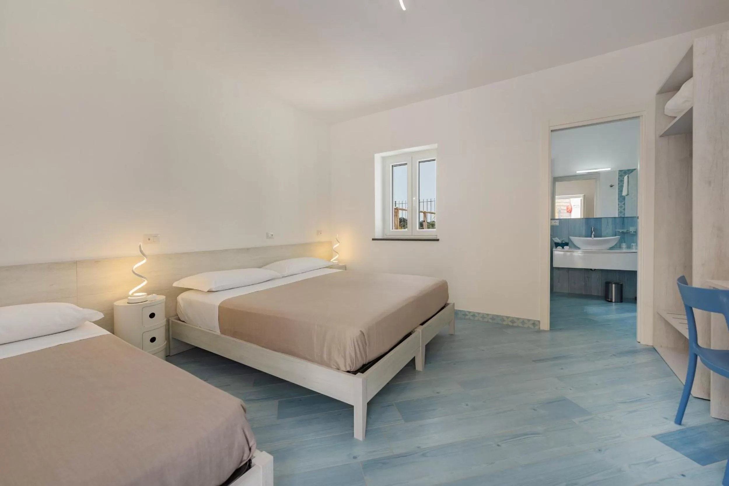 Bed in Poseidonia Rooms