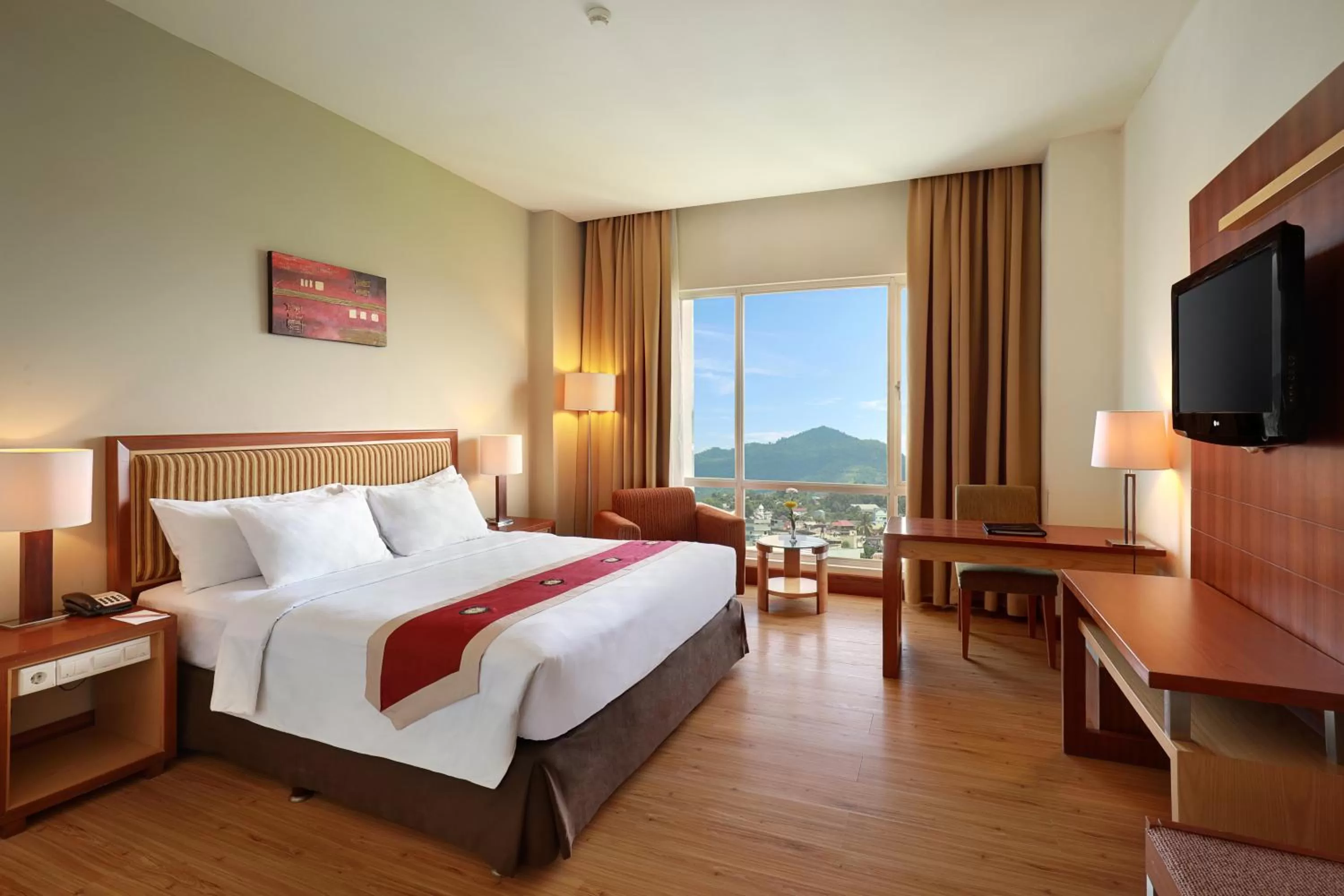 Bed in Swiss-Belhotel Maleosan Manado