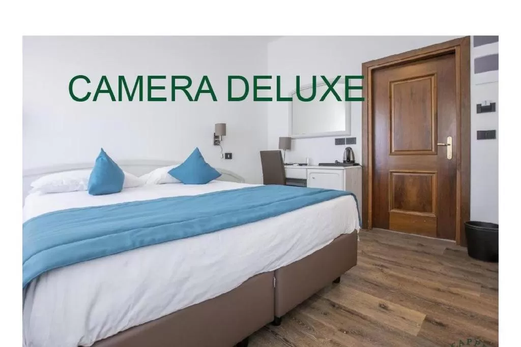 Bed in Albergo Cappello e Cadore