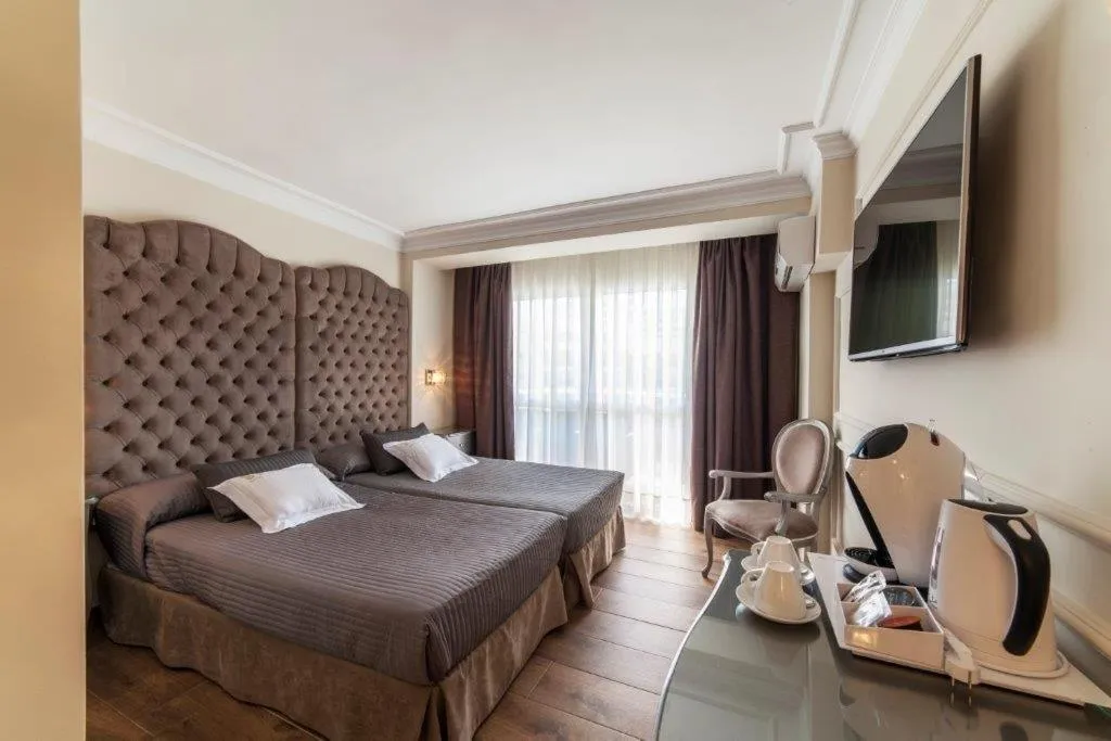 Bed in Essence Hotel Boutique