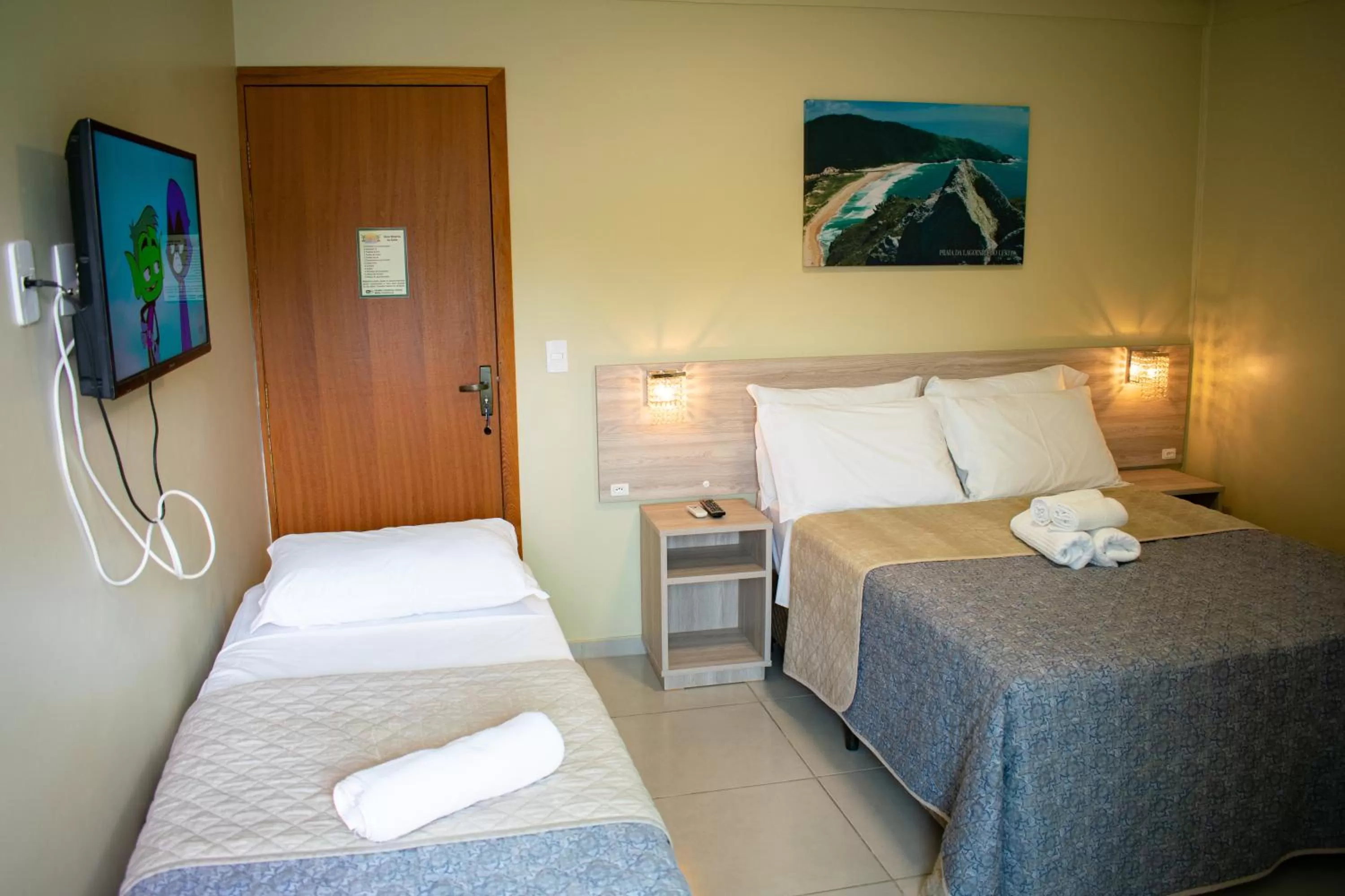 Bed in Pousada Tissiano