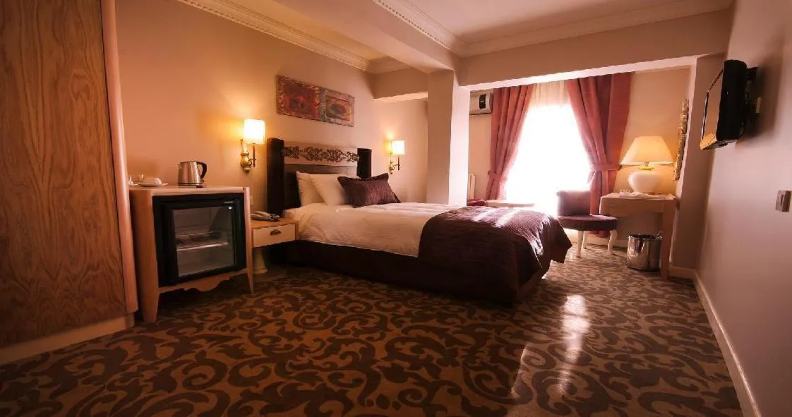 Bed in Sonno Boutique Rooms & Suites